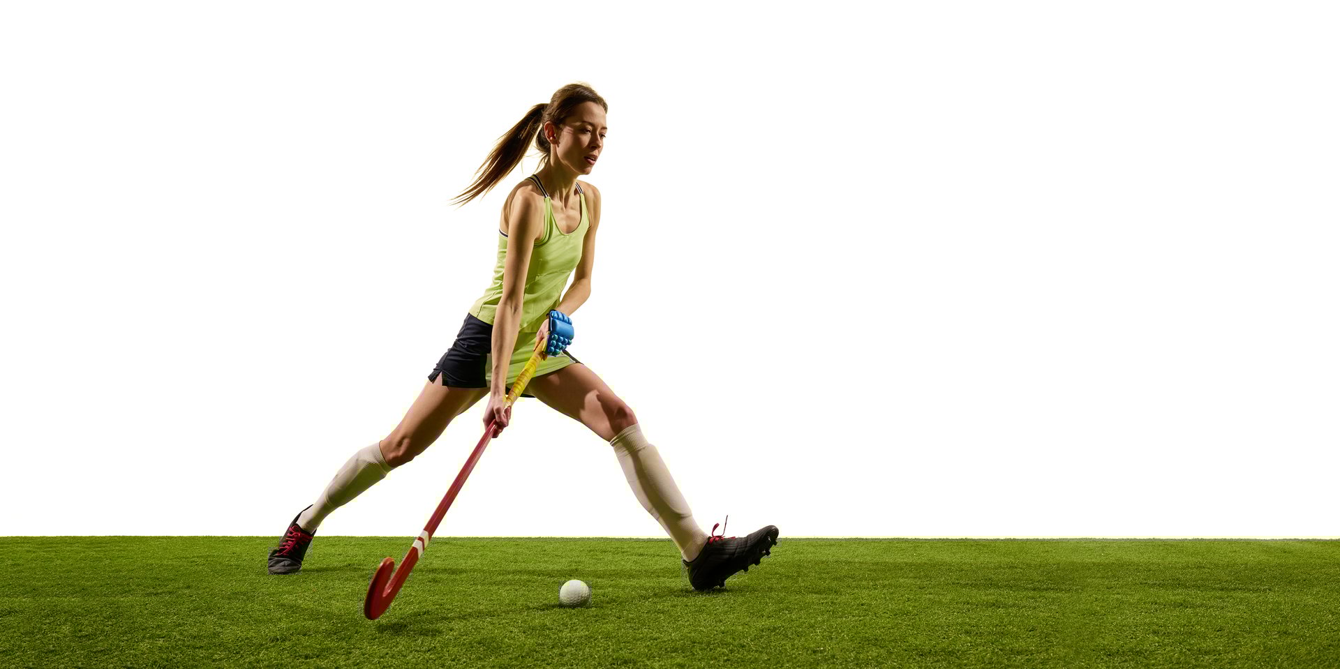 Female hockey player moves forward with drive and confidence demonstrating fluid coordination and game strategy. Concept of sport events, competition, championship, game, movements.