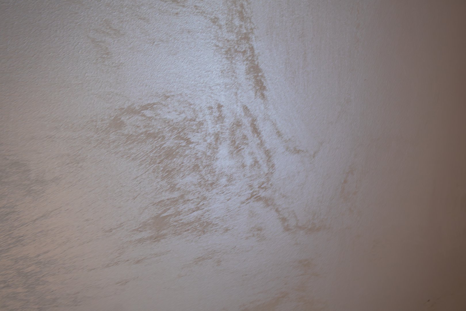 A textured wall in a contemporary room displays interesting patterns and soft shades, creating a calming atmosphere.