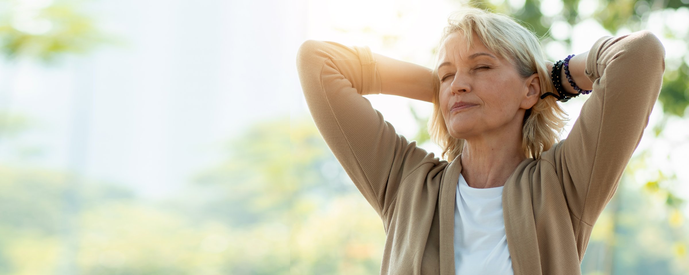 Portrait of happy senior woman relax in park