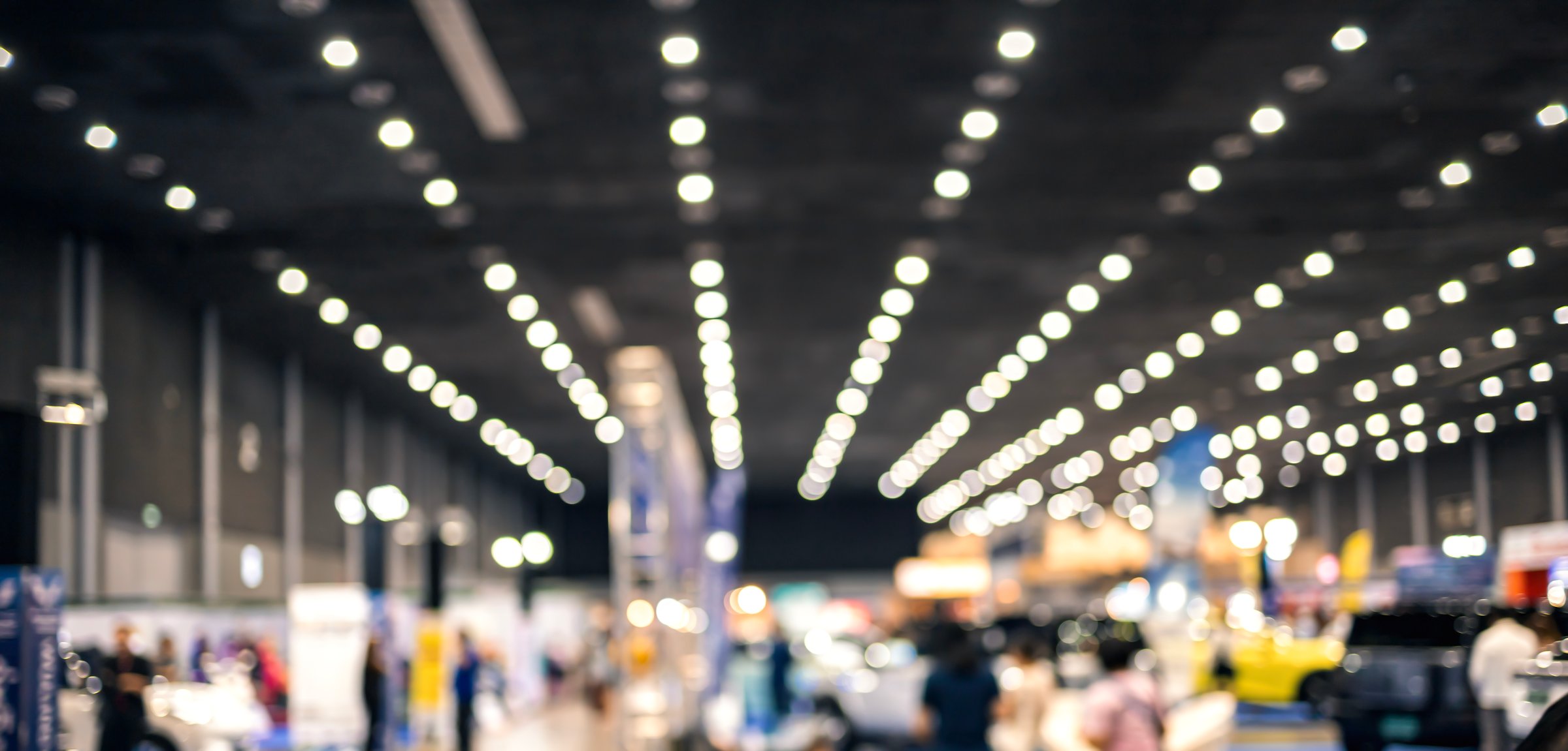 Vintage tone abstract blur image of Shopping mall or Exhibition hall with bokeh for background usage .