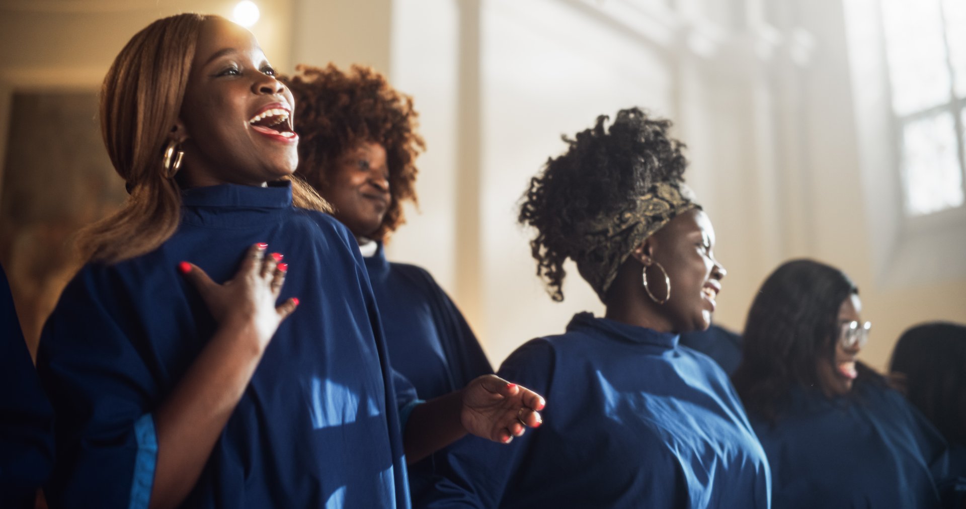 Gospel singers in church sharing the message with uplifting music