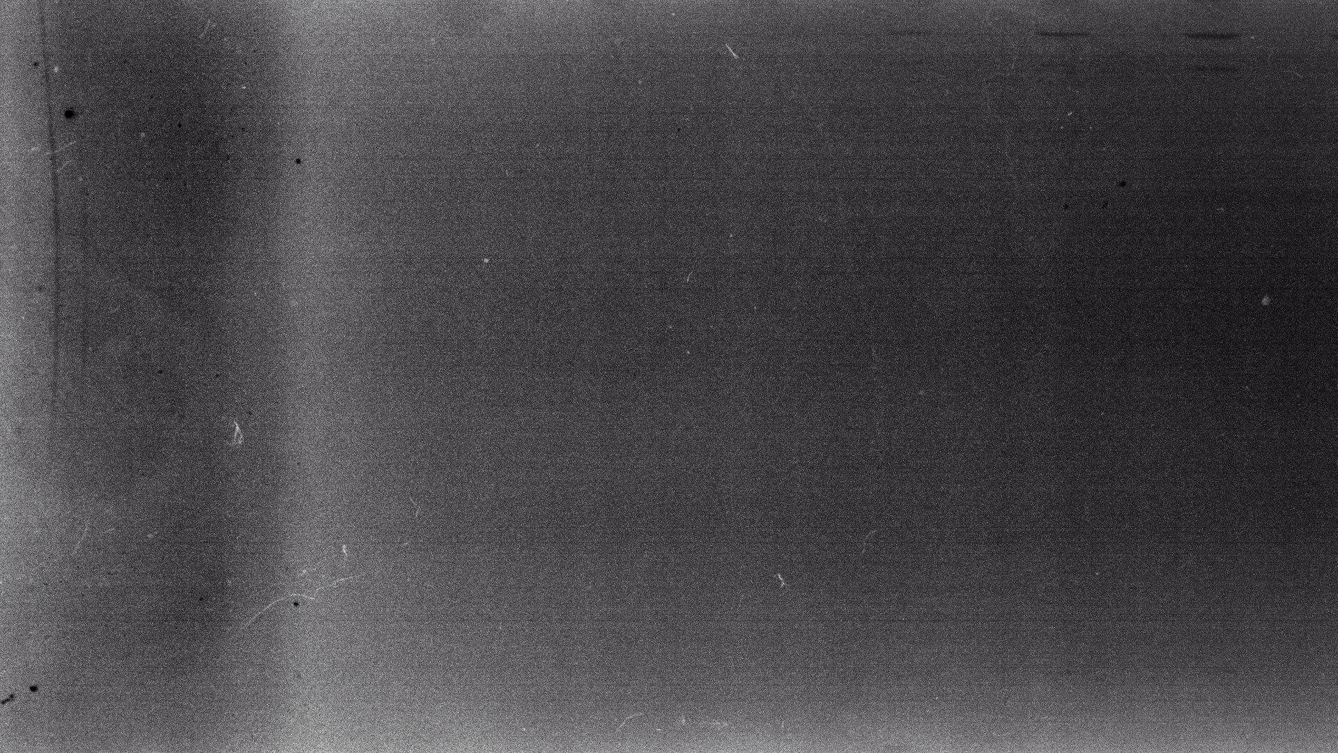 Blank grained film strip texture background with heavy grain and dust