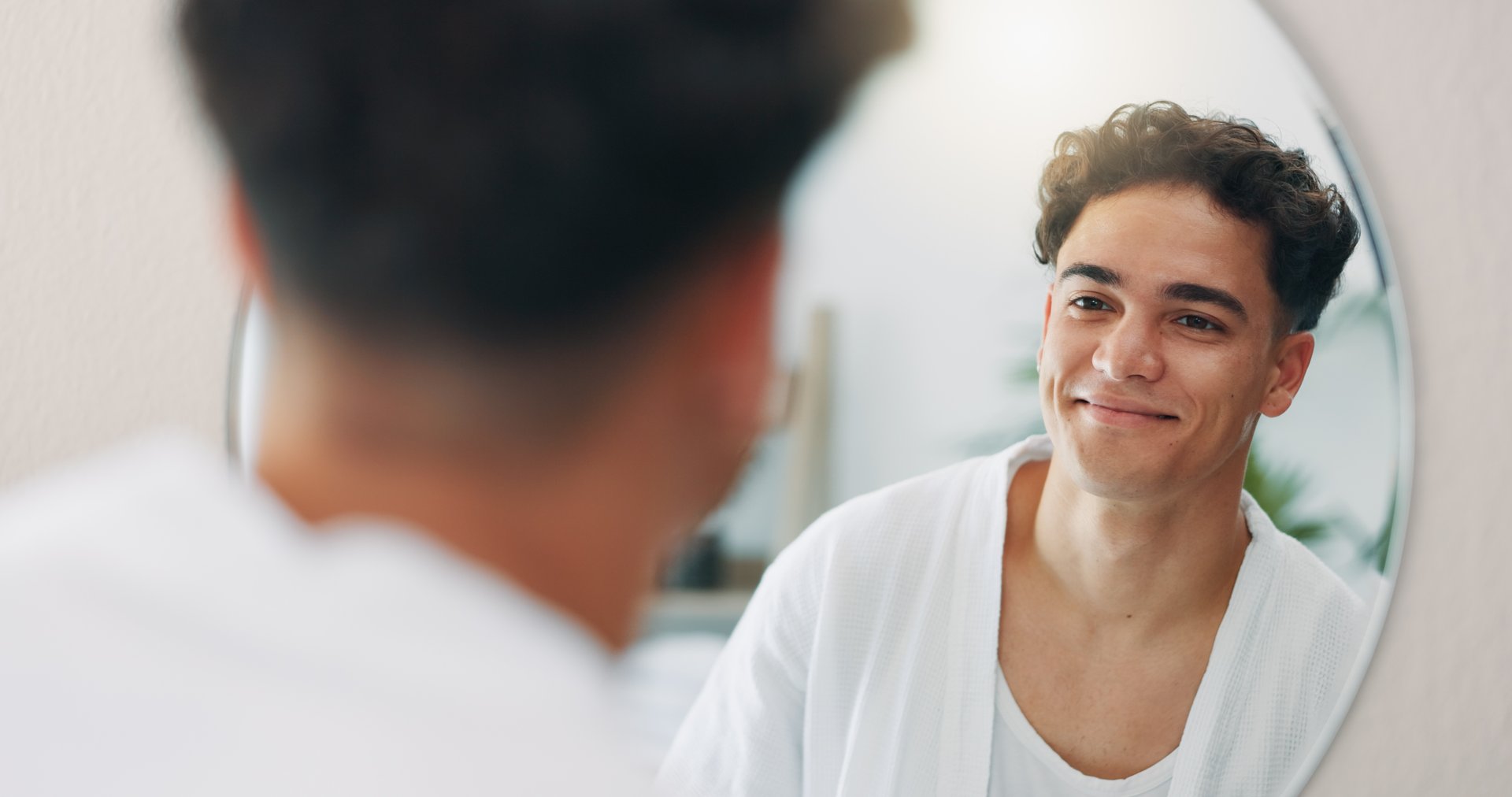 Man looking in mirror reflection self examination honesty