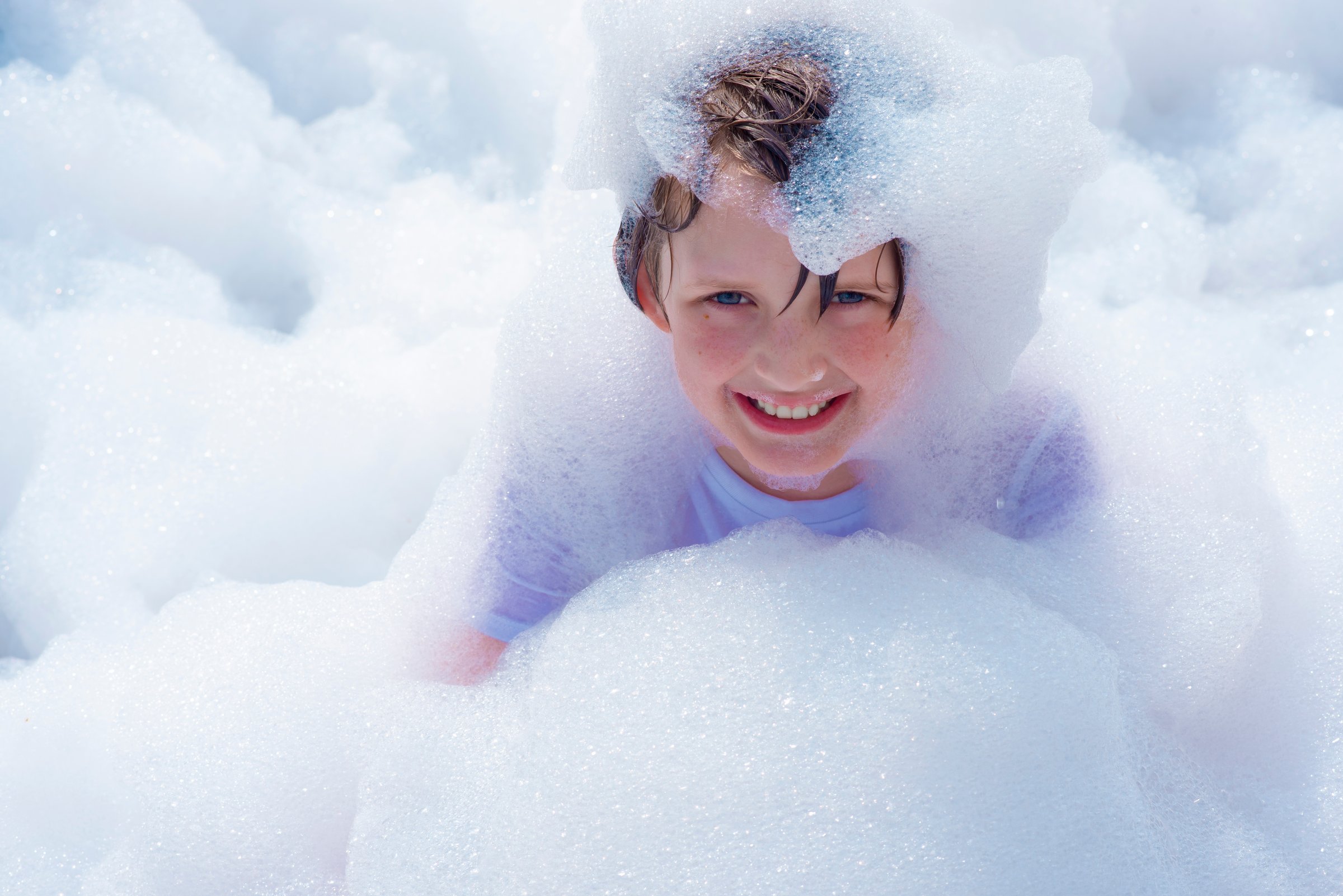 9 year old boy at a children's party, foam party