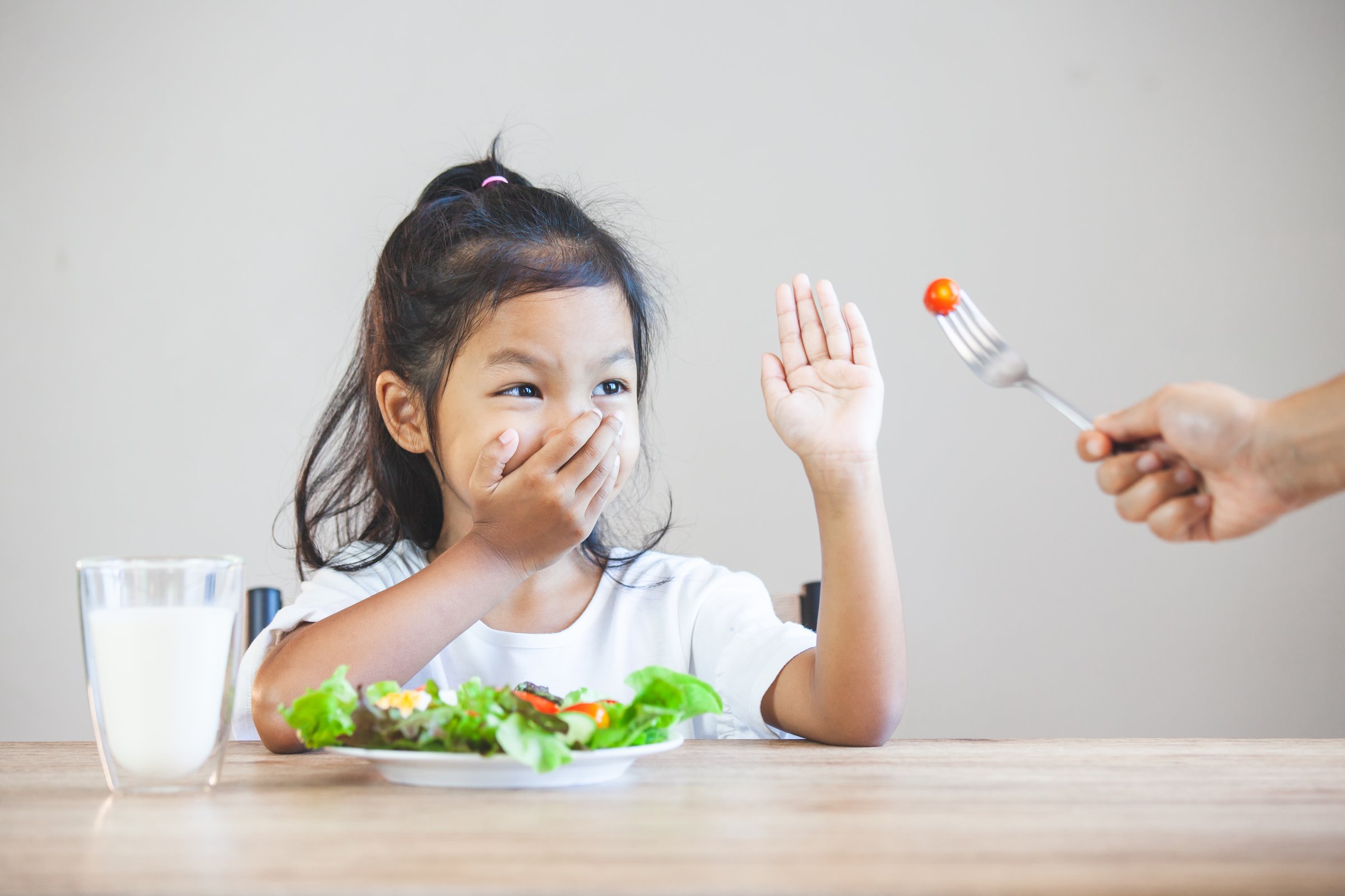 Asian child does not like to eat vegetables and refuse to eat healthy vegetables