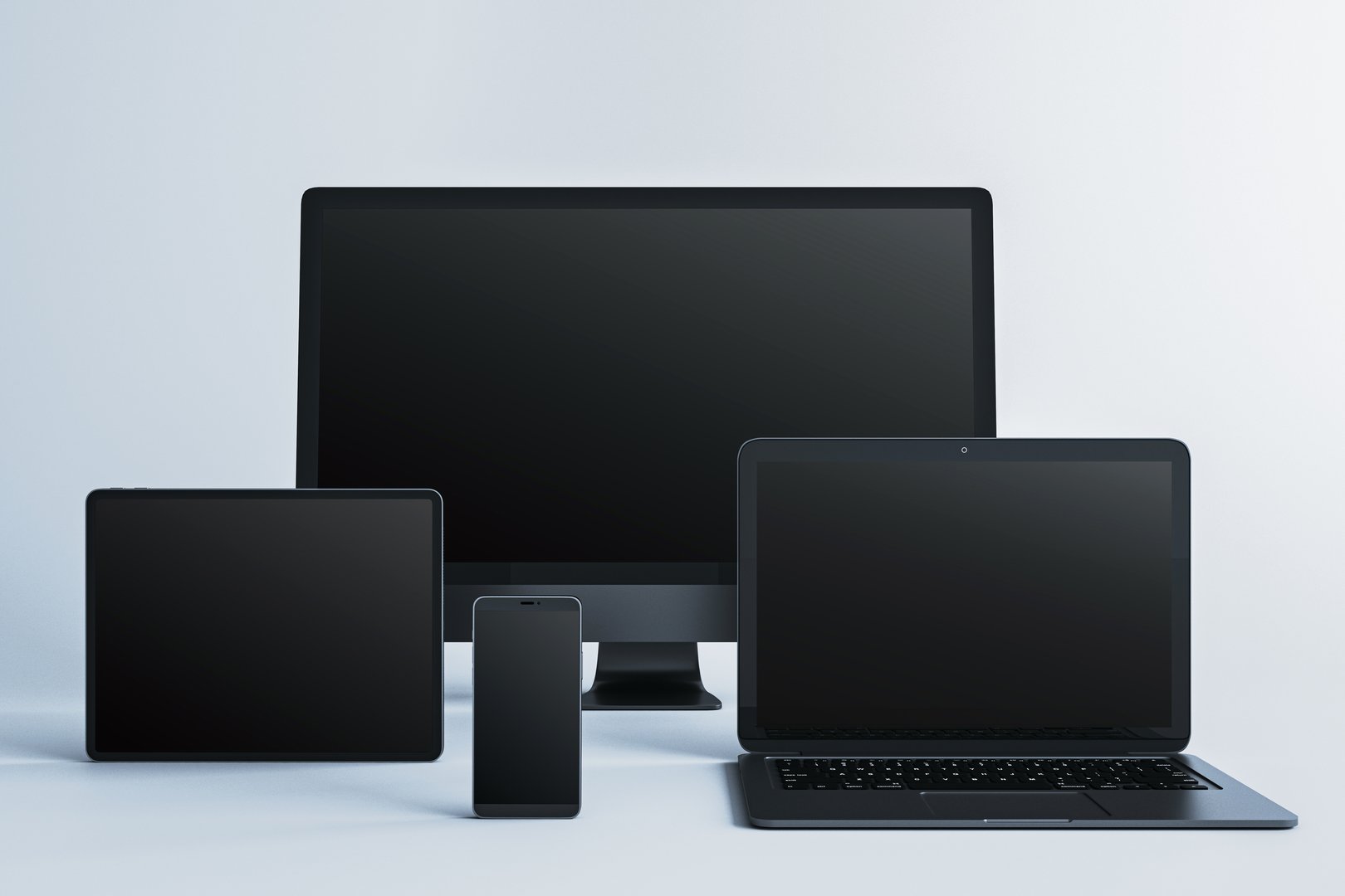 Blank screen mockup of desktop computer, laptop, tablet, and smartphone in clean layout on light background, concept of digital device presentation. 3D Rendering