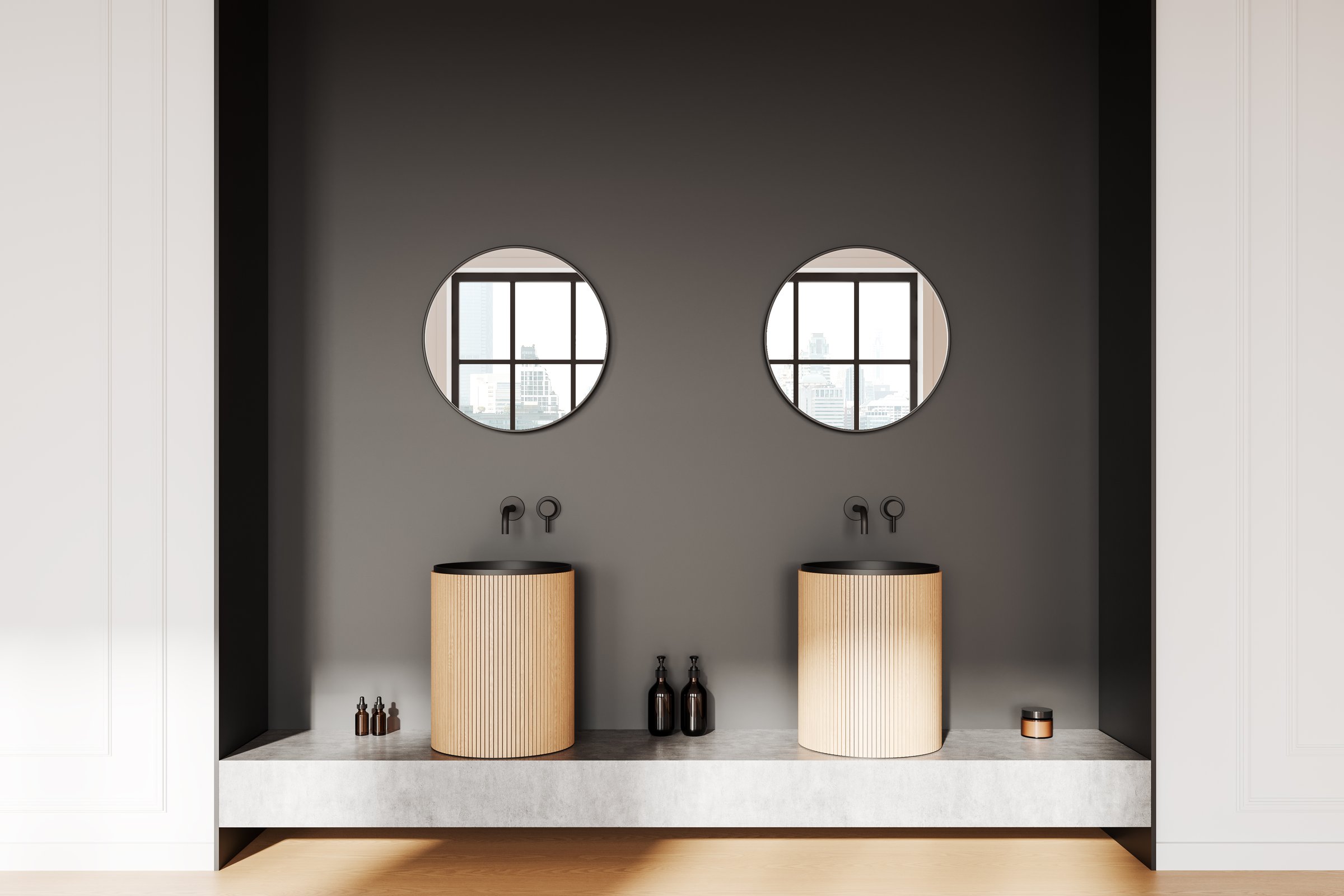 Twin wood vanities with round mirrors on a dark wall, concrete countertop, and cityscape reflections, minimalist bathroom design concept. 3D Rendering.