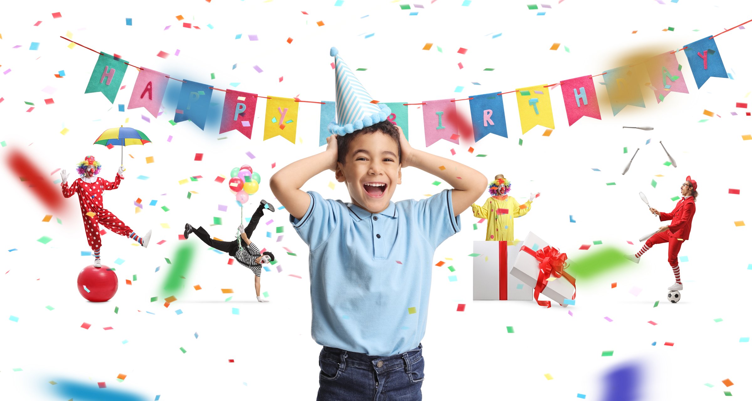 Overjoyed kid at a birthday party with clowns isolated on white background