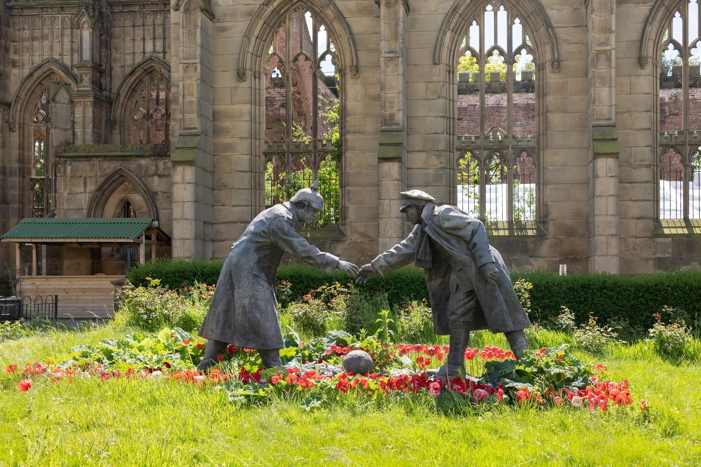 Liverpool, united kingdom May, 16, 2023 The sculpture All Together Now by Andy Edwards outside the bombed out church of St John's in Liverpool