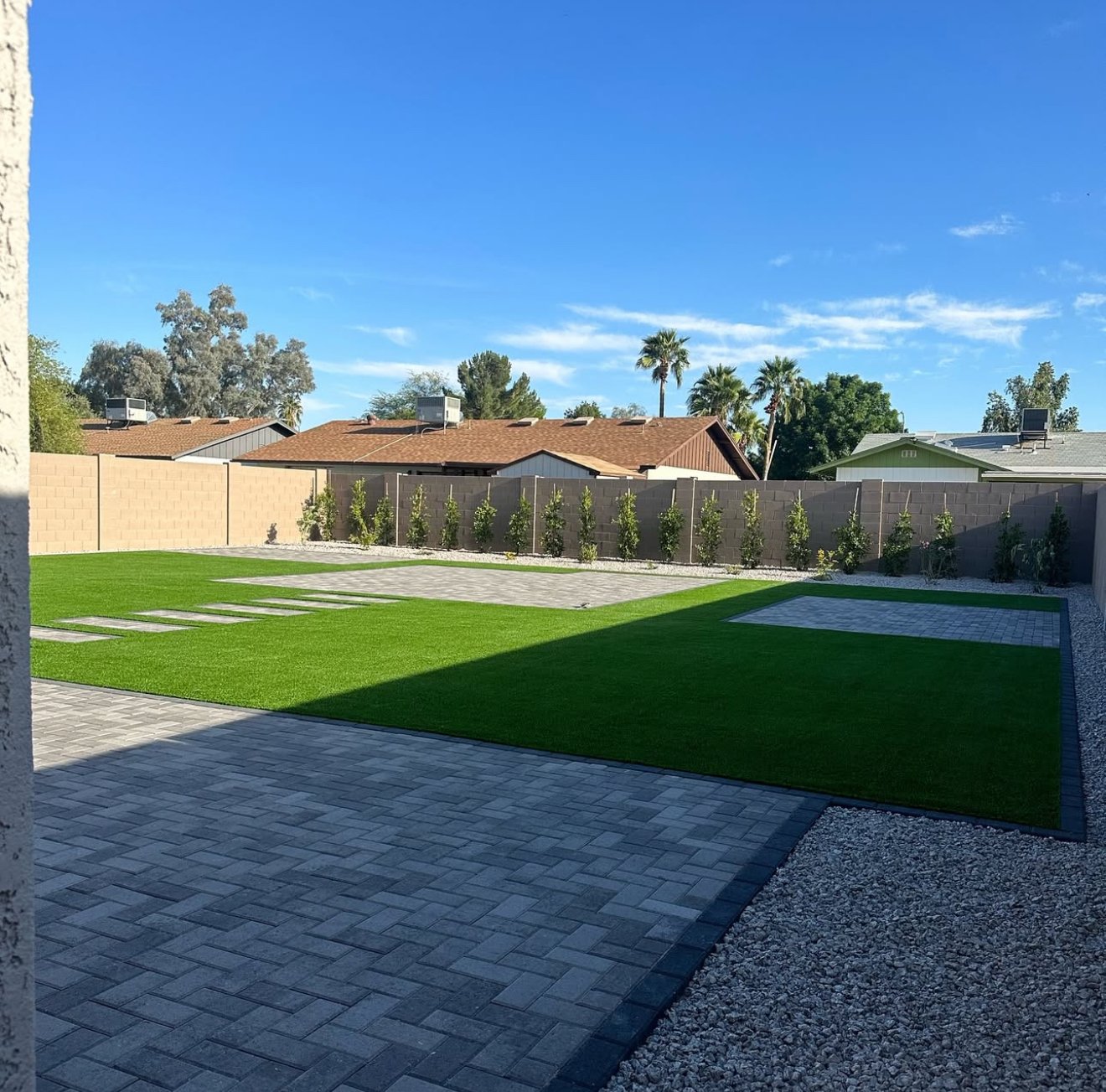 Custom pavers, artificial turf, and landscaping rock
