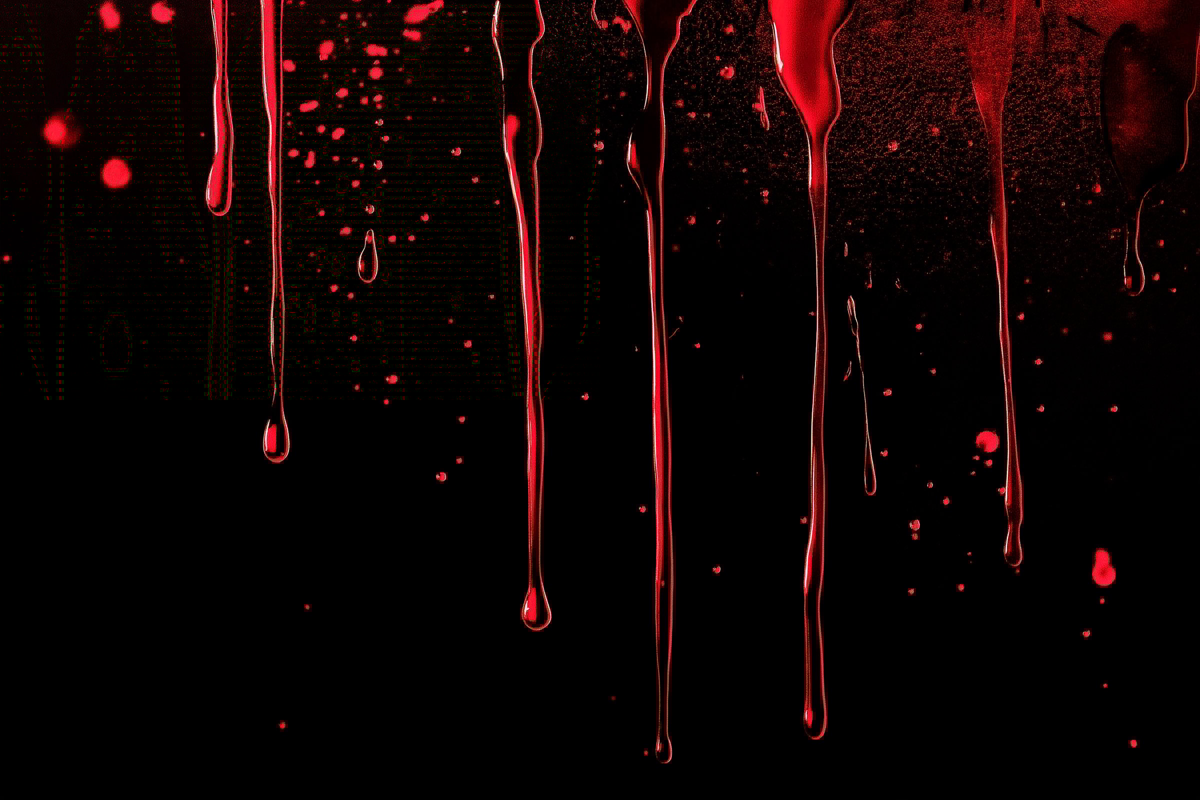 A blood splatter overlay over a black background