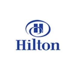 Blue Hilton logo with stylized 'H' inside a circle above the word "Hilton" on a white background.