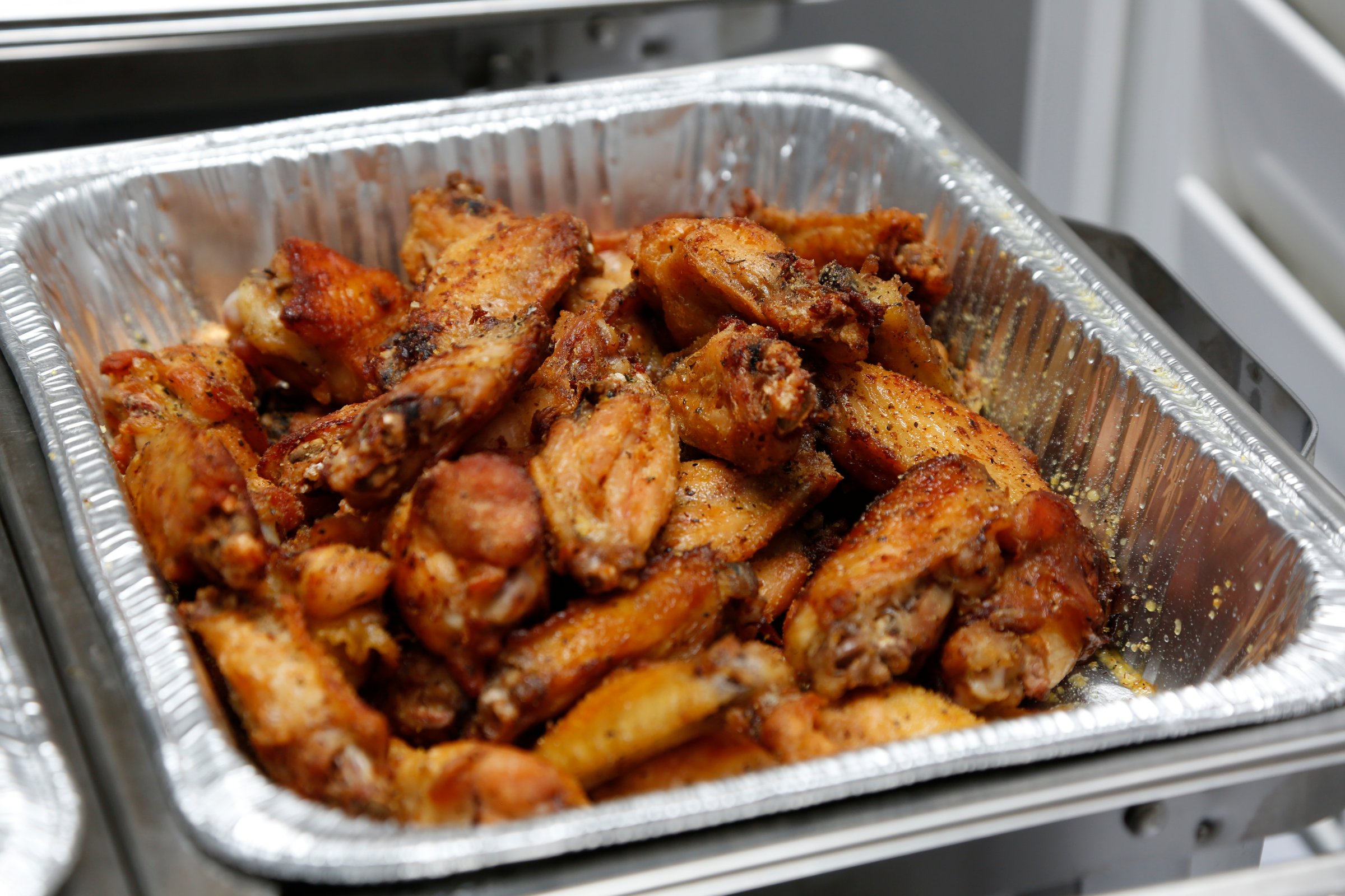 A view of a tray of dry rub chicken wings