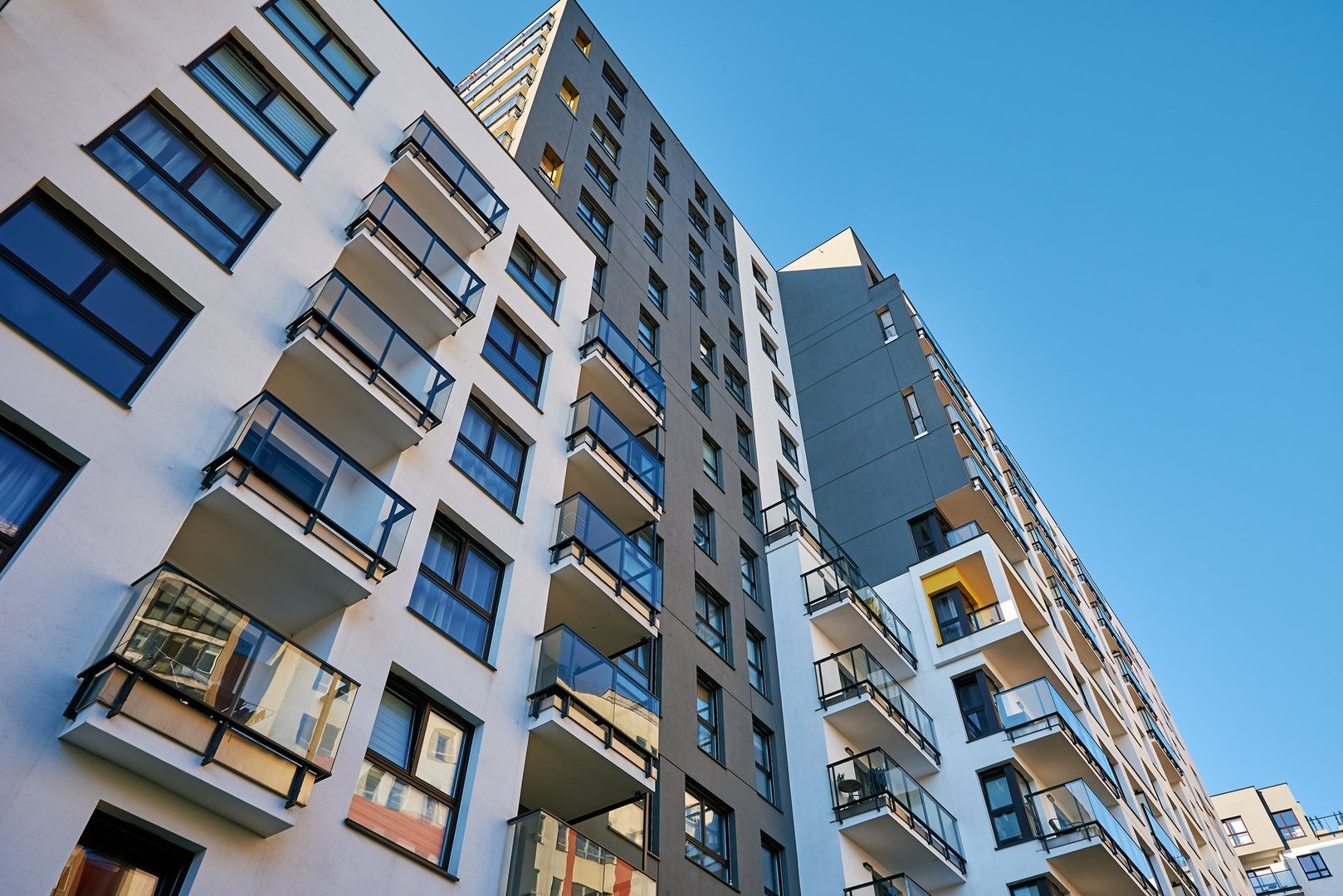 Modern city architecture, Residential house building facade with balconies in Warsaw.