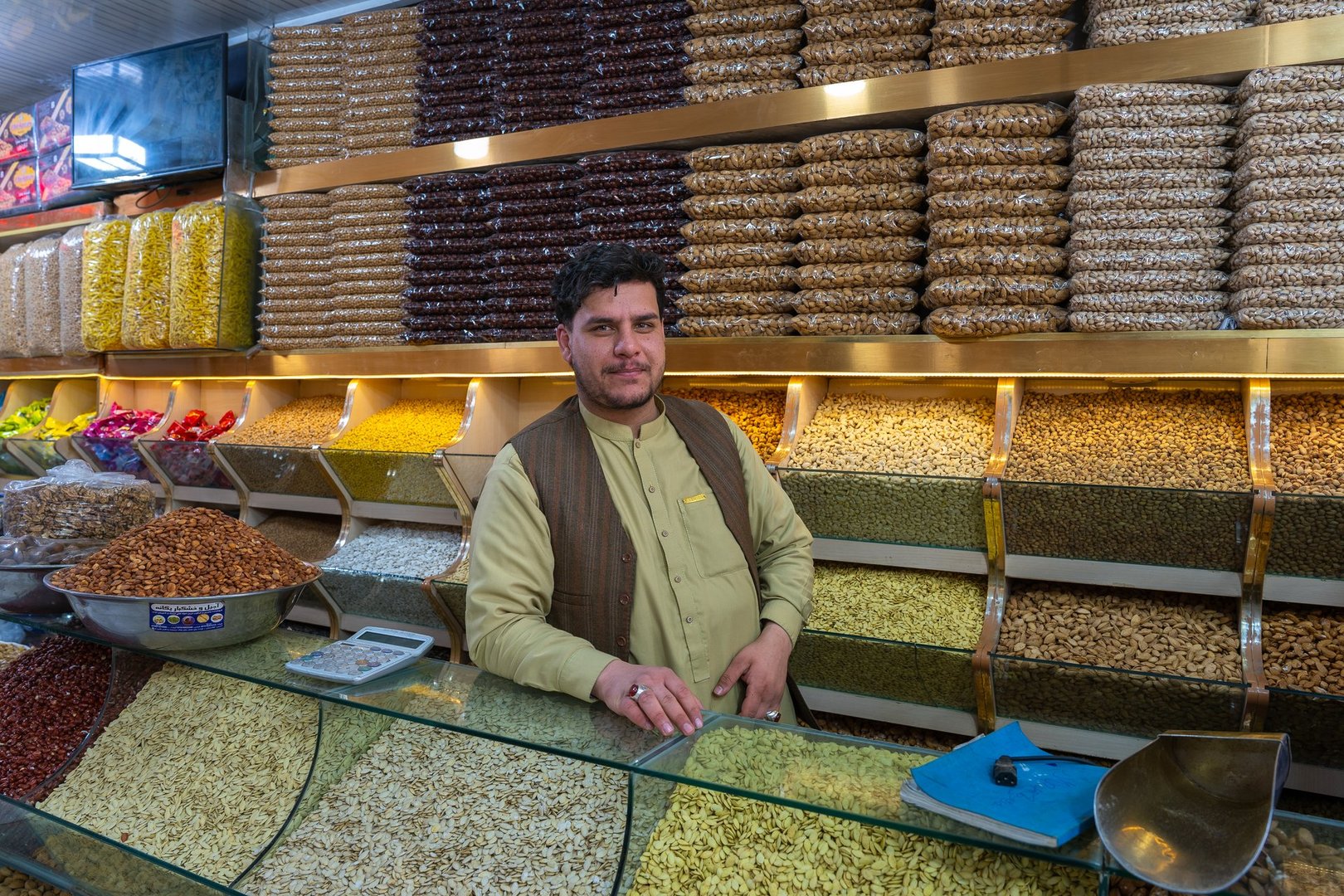 Herat, Afghanistan, 03.17.2025 Afghan man selling spices and nuts