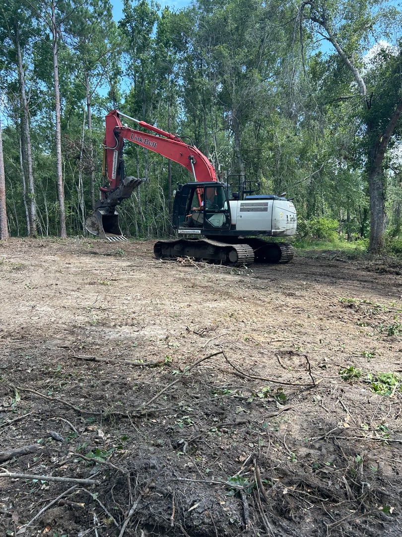 Professional equipment clearing land