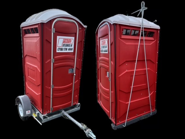 Trailer porta potty and crane-ready porta potty