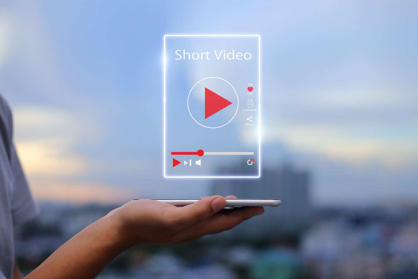 Man hands holding mobile phone showing virtual short video player with blurred city as background