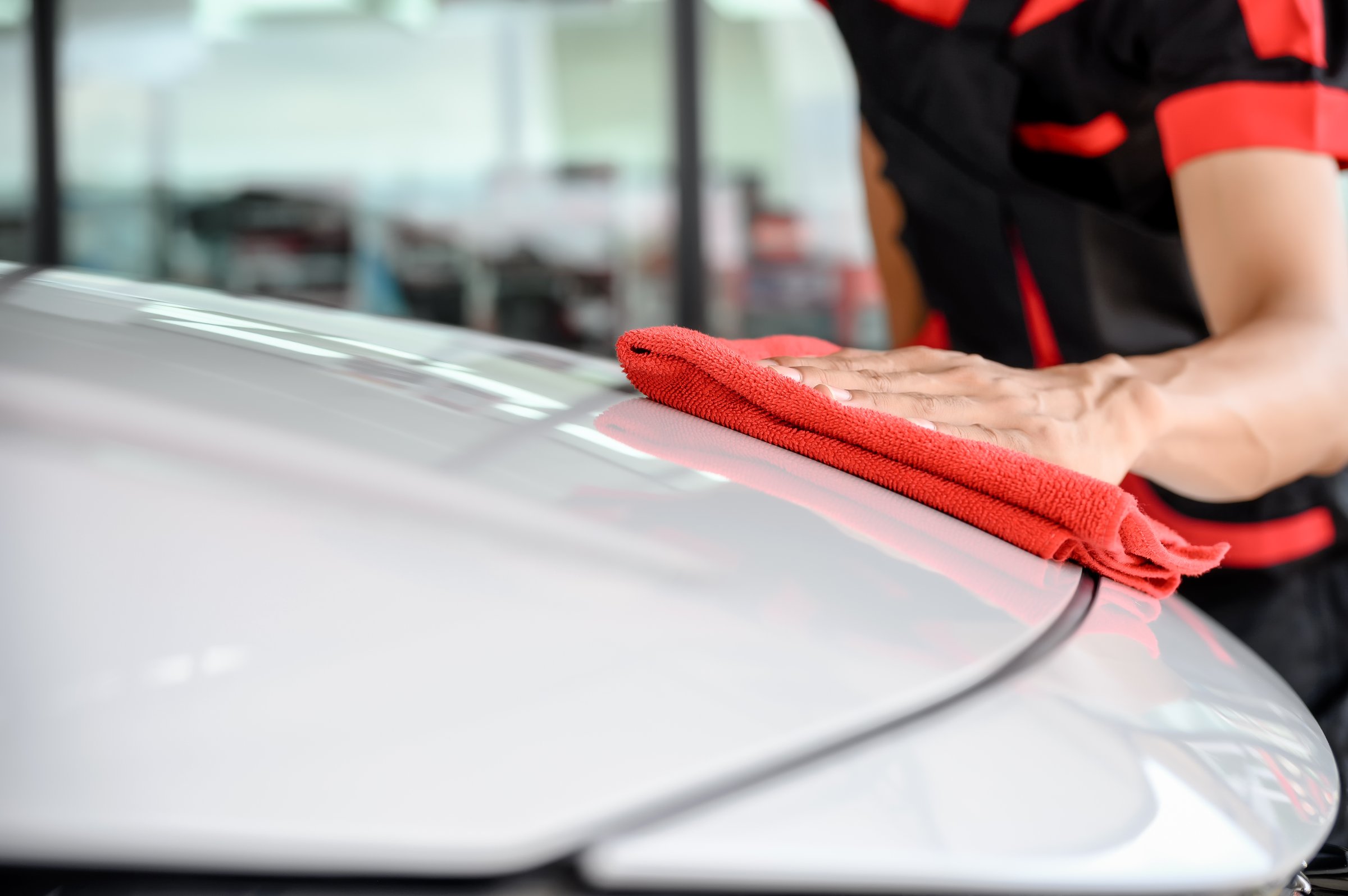 Car Wash Services, Cleaning with Cloth at Car Wash and Detailing Station for Vehicle's Maintenance. Expert Car Cleaning and Grooming at Car Wash Station.