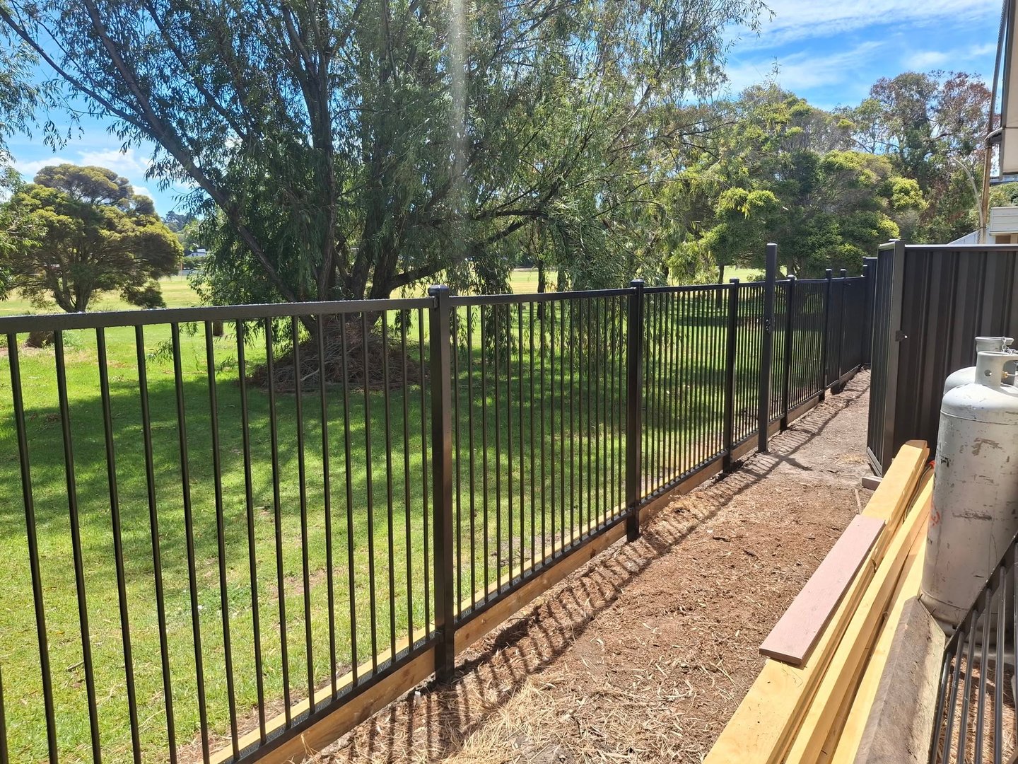 Fencing services - worker taking measurements