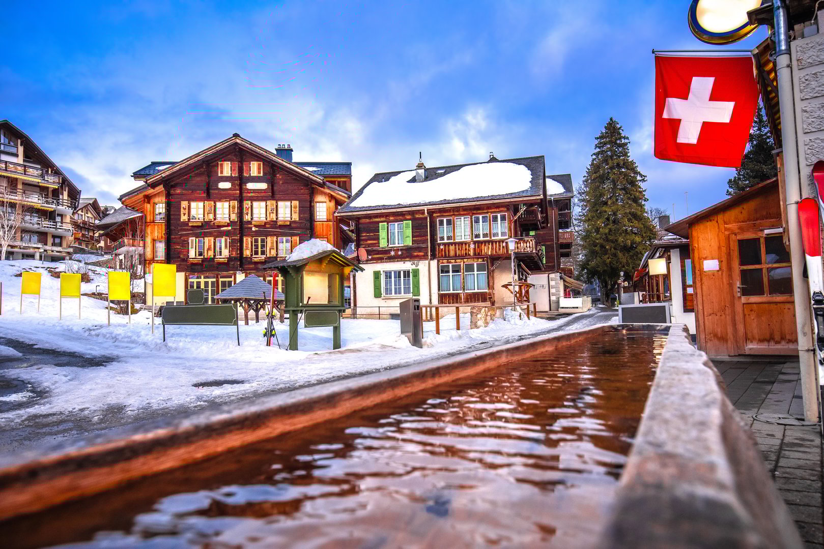 Idyllic Alpine village snow evening view