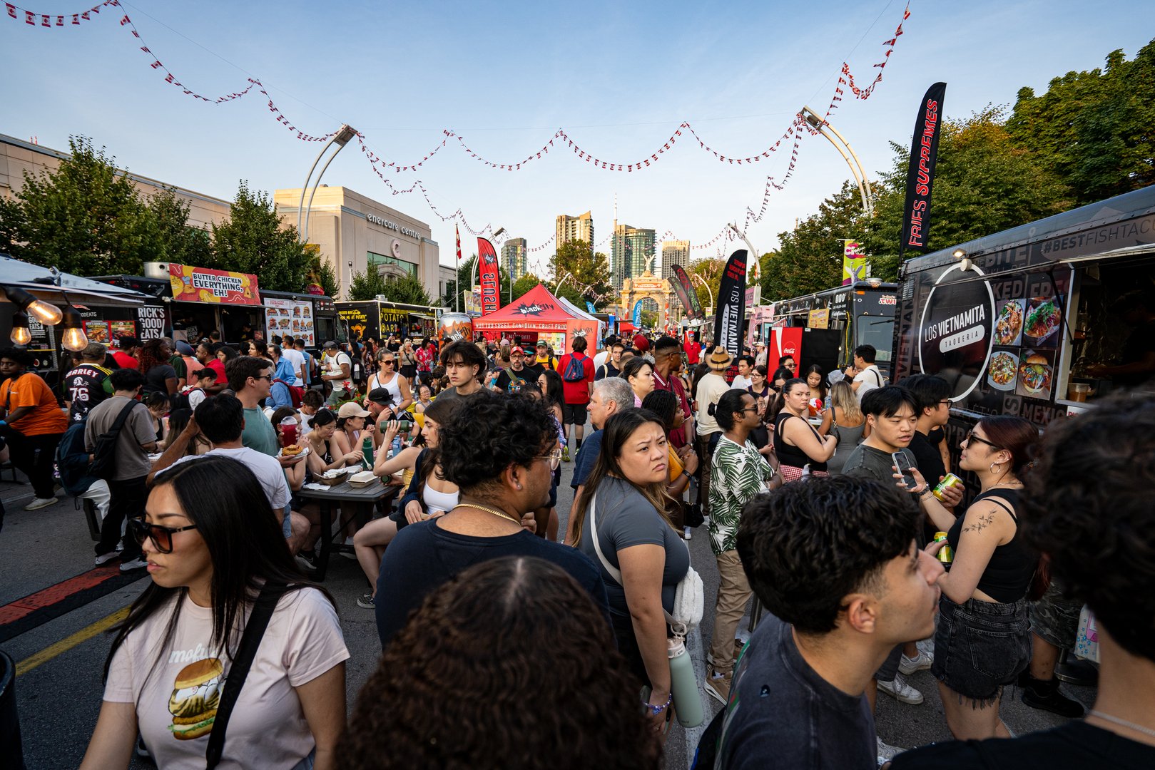 Crowds enjoying food trucks and dining area at Canadian National Exhibition CNE. Toronto, Canada - August 16, 2025.