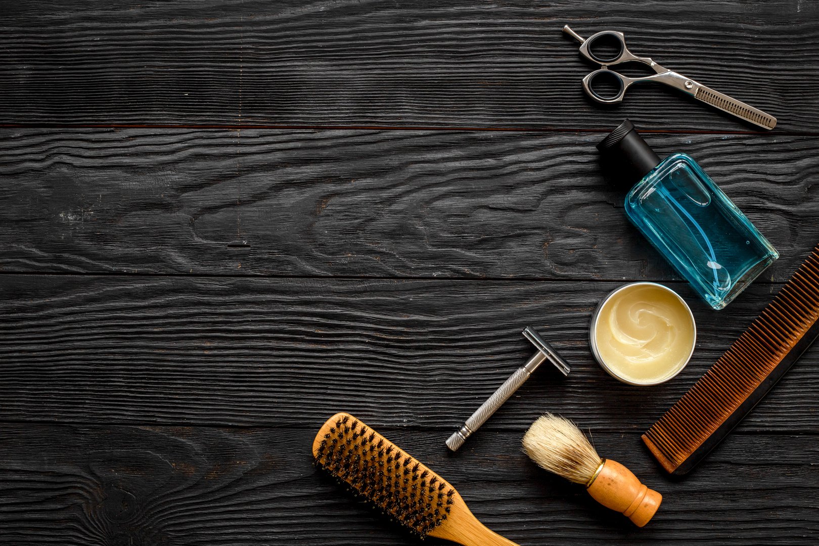 Set of shaving tools and cosmetic products in barbershop.