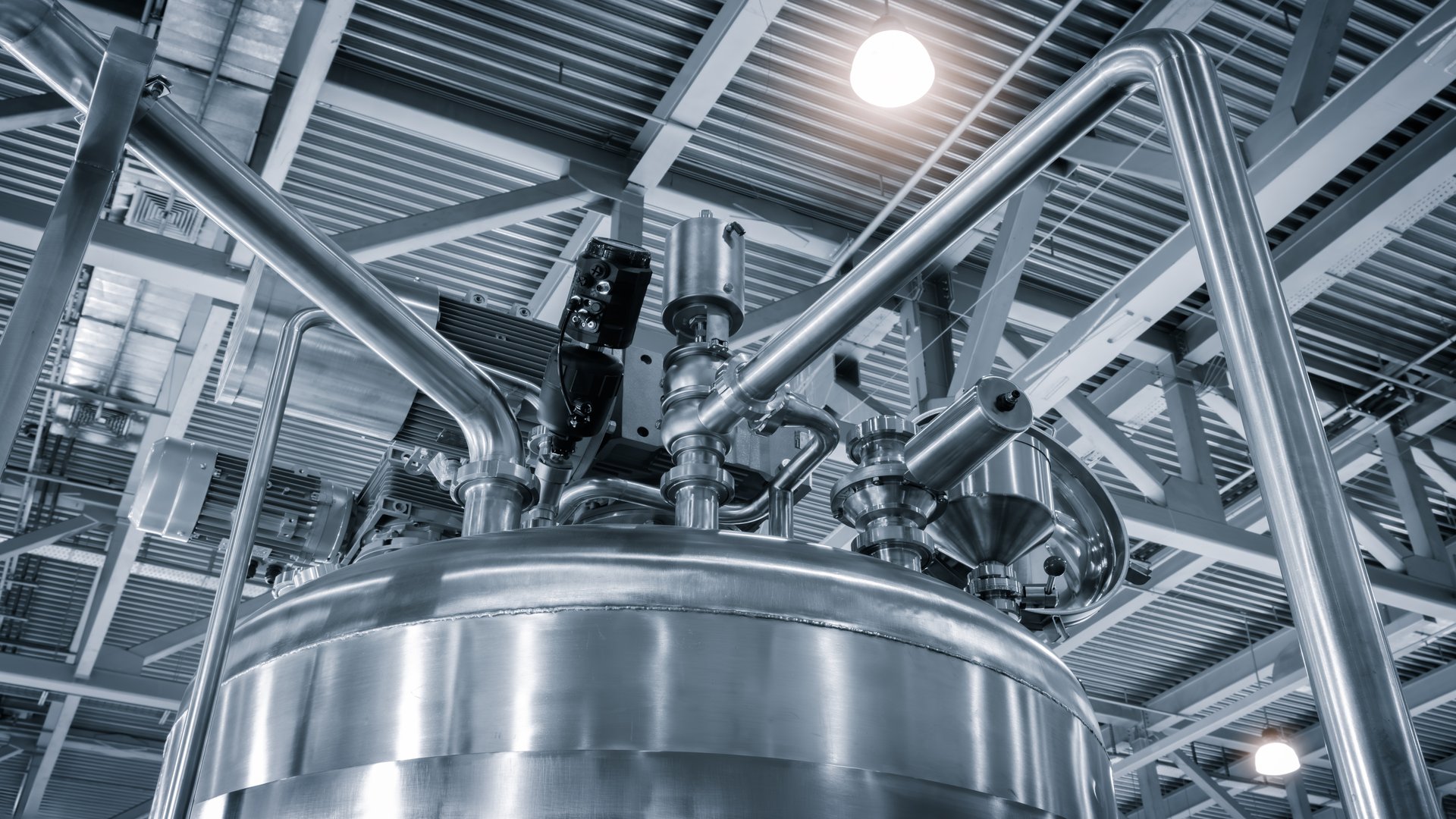 Food production machine with stainless steel pipes, cooling radiator as separator and tanks, valves  measuring instruments.