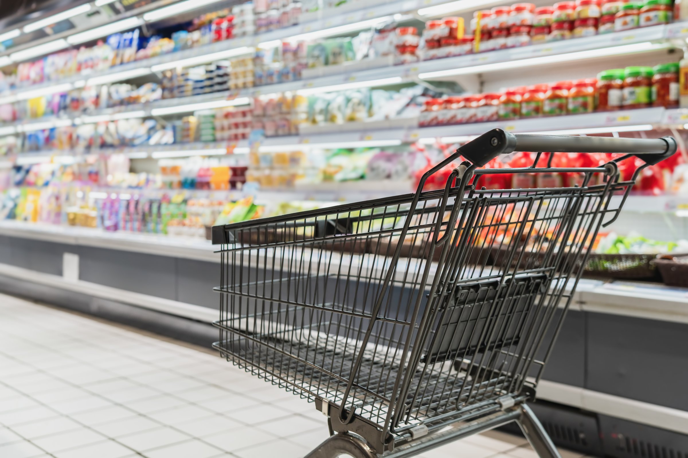 Empty shopping cart in grocery store