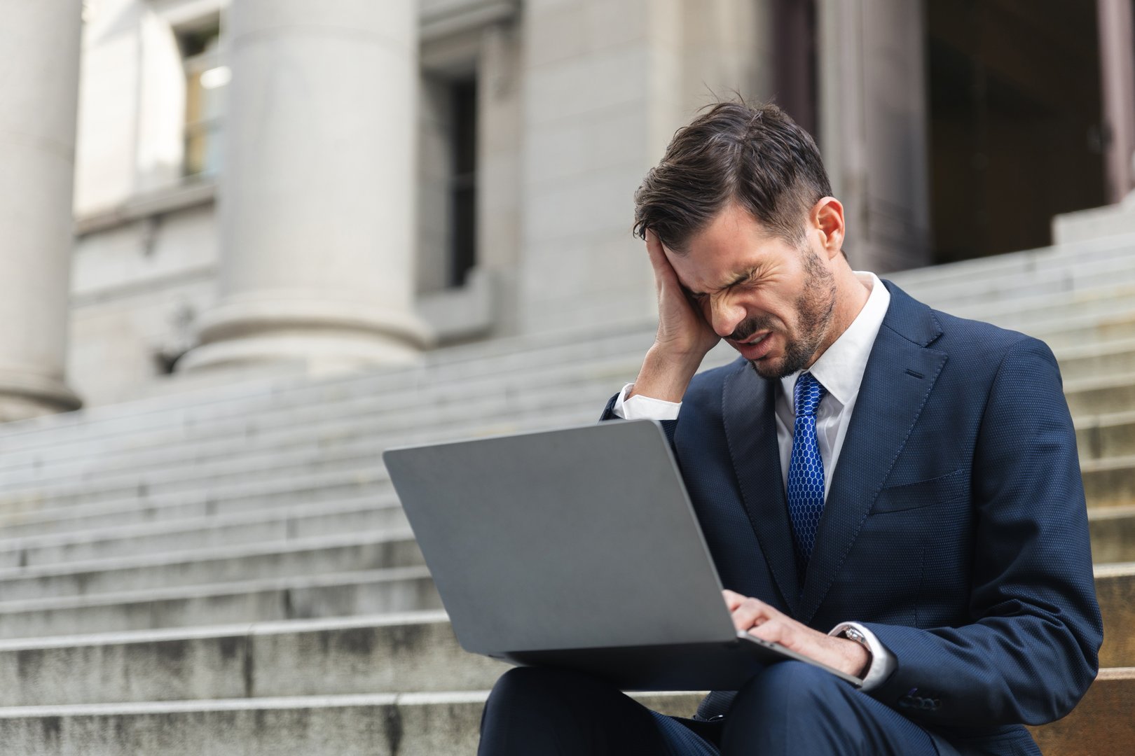 Sad investor get bad news when his loan amount credit reject in front of bank, business of finance and unemployment