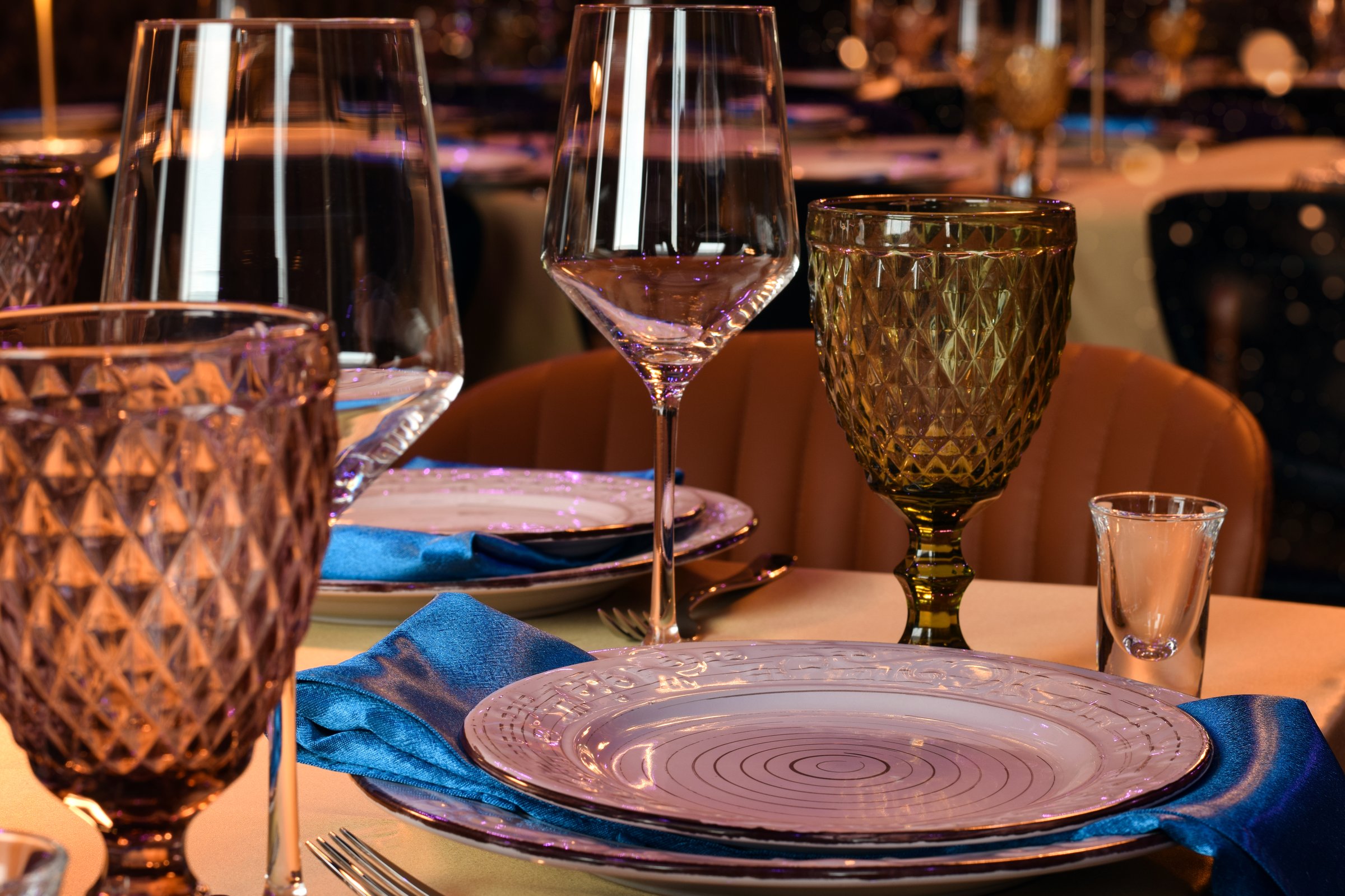 Closeup of elegant table with goblets and wine glasses