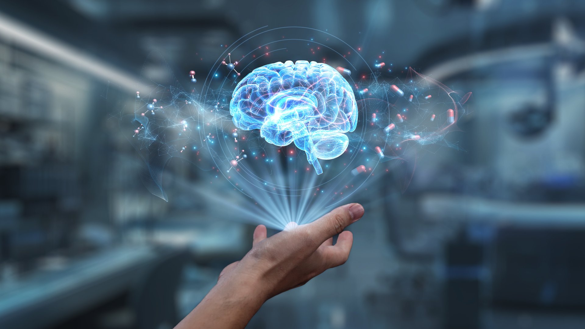 Human hand holding brain holographic floating at laboratory