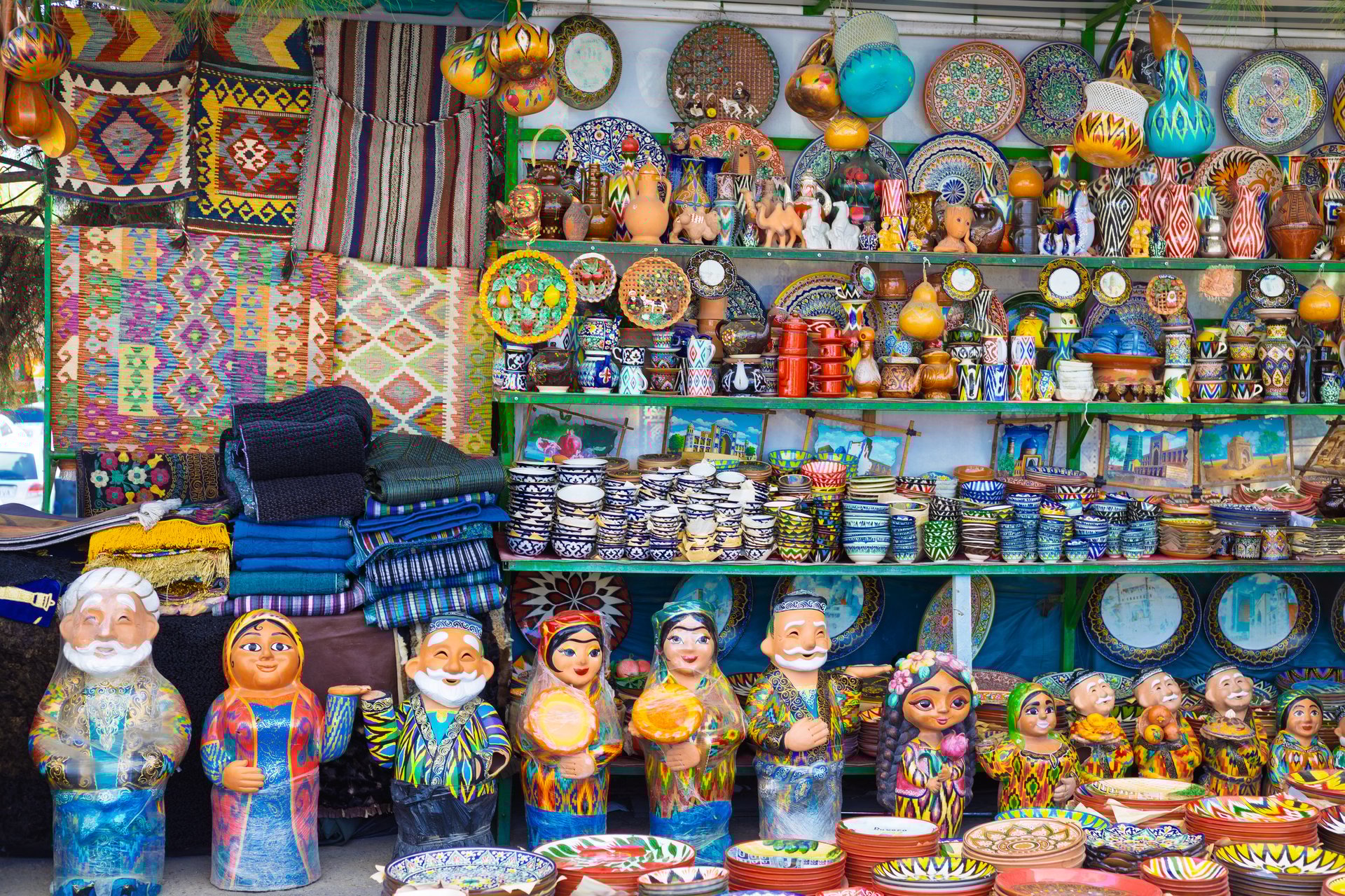 Typical ceramic colorful souvenirs selling with traditional national ethnic Uzbek patterns at street vendor on bazaar in Tashkent, Uzbekistan