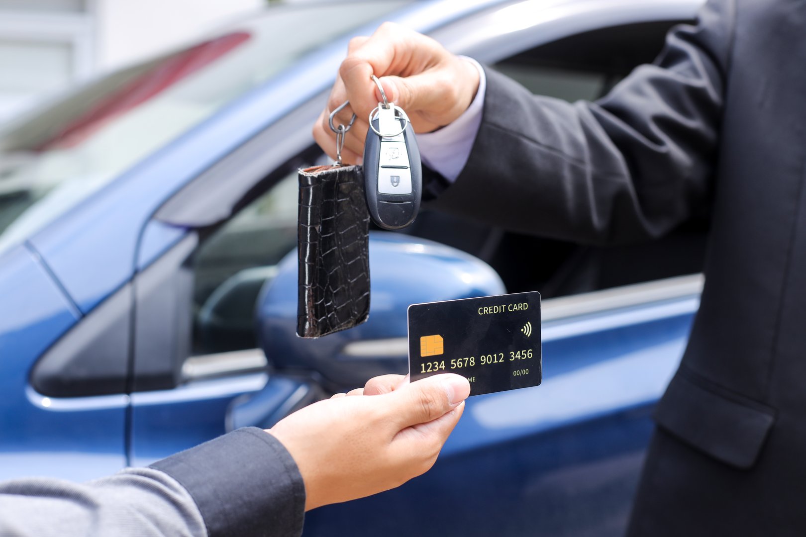 Exciting Car Purchase With Credit Card and Keys for New Blue Vehicle