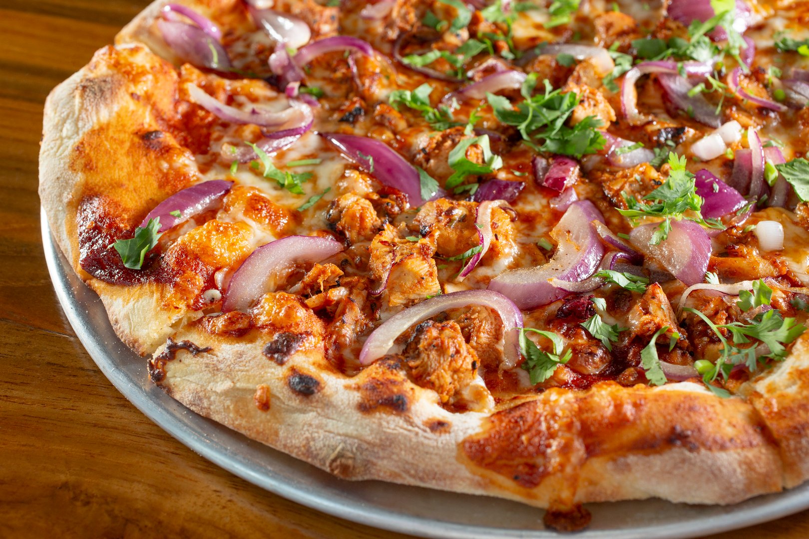 A view of a BBQ chicken pizza.