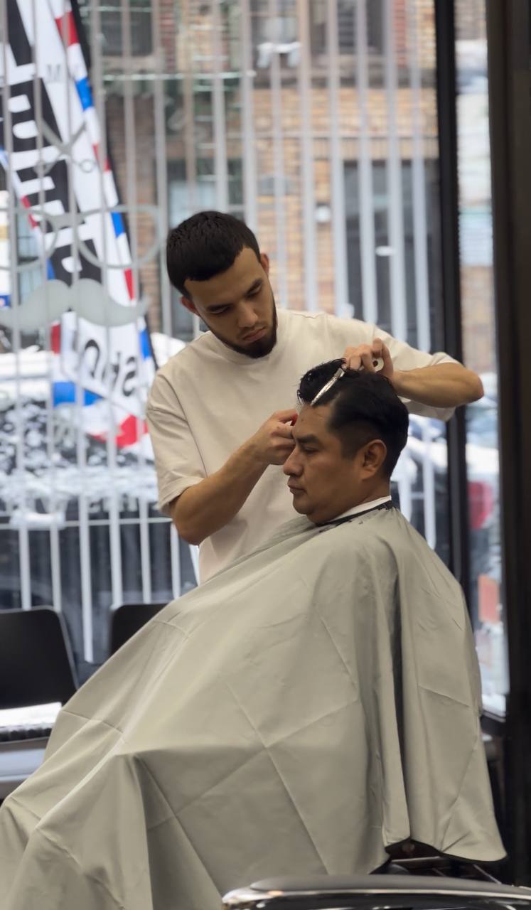 Bobur - Expert Barber at Level Barbershop providing premium grooming services