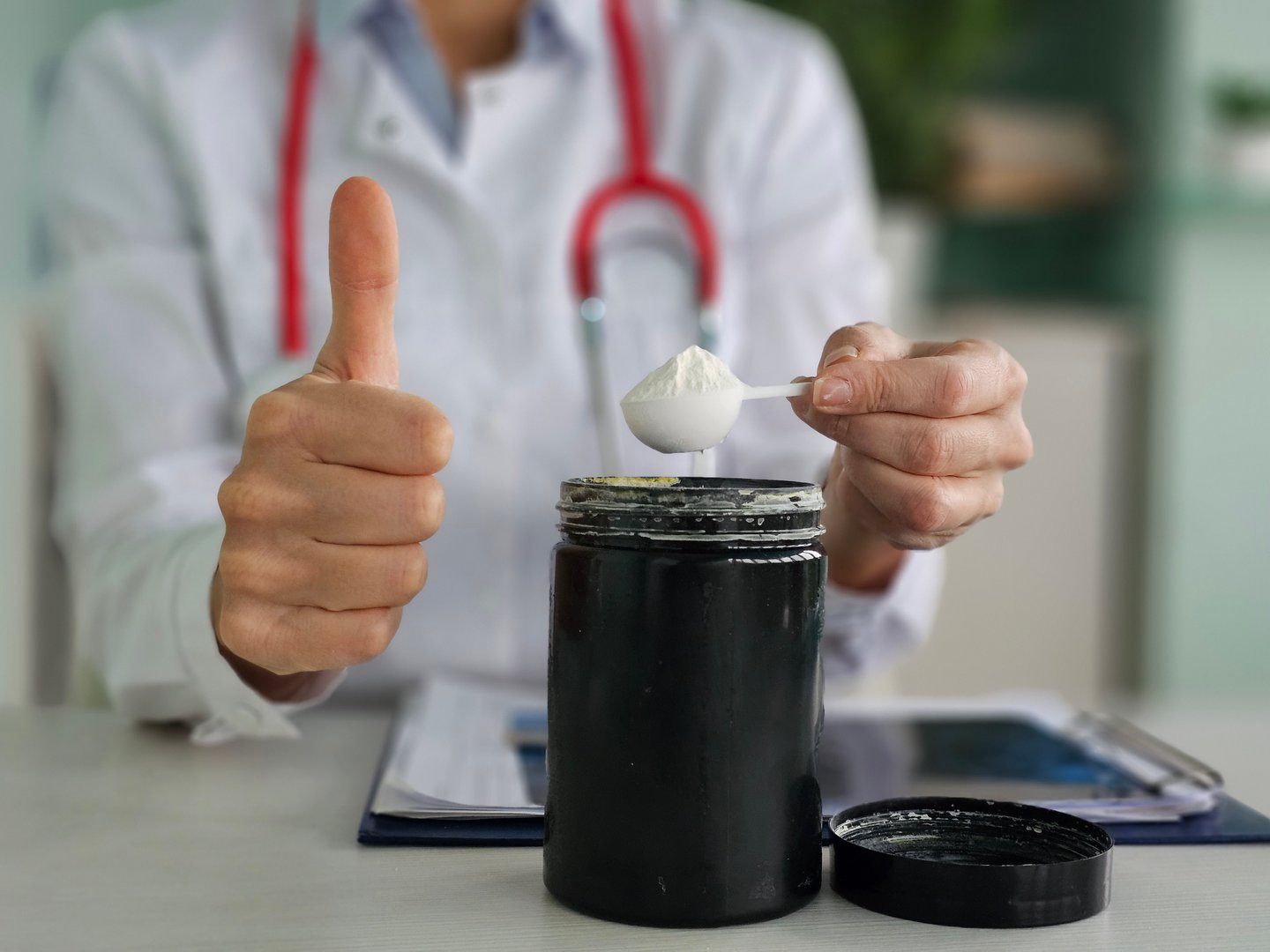 Health professional shows approval for nutritional supplement preparation in clinic setting