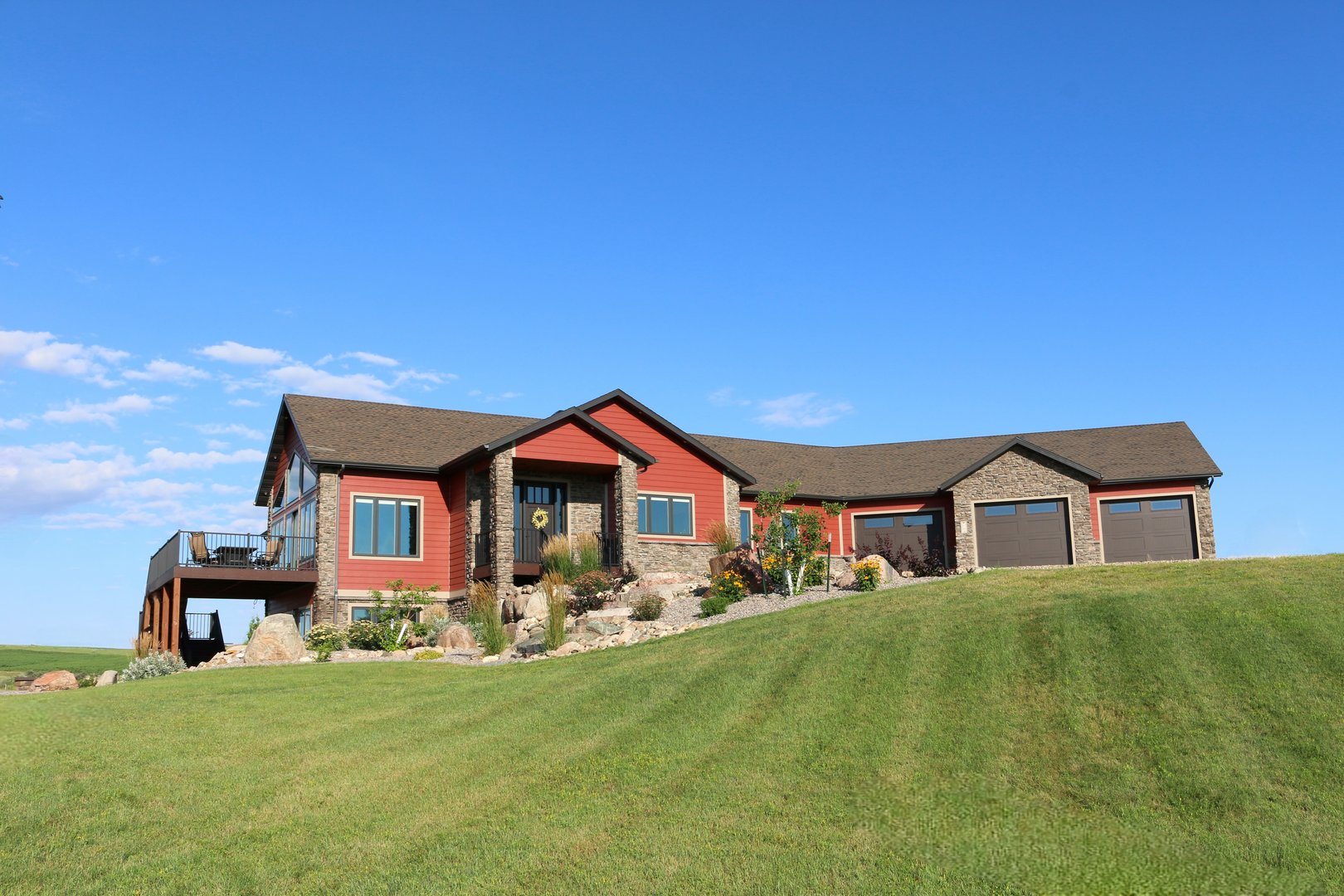 New Custom Build large single family home in a rural setting with acreage and beautiful green scenery, exterior photos. Ranch style with walk out basement.