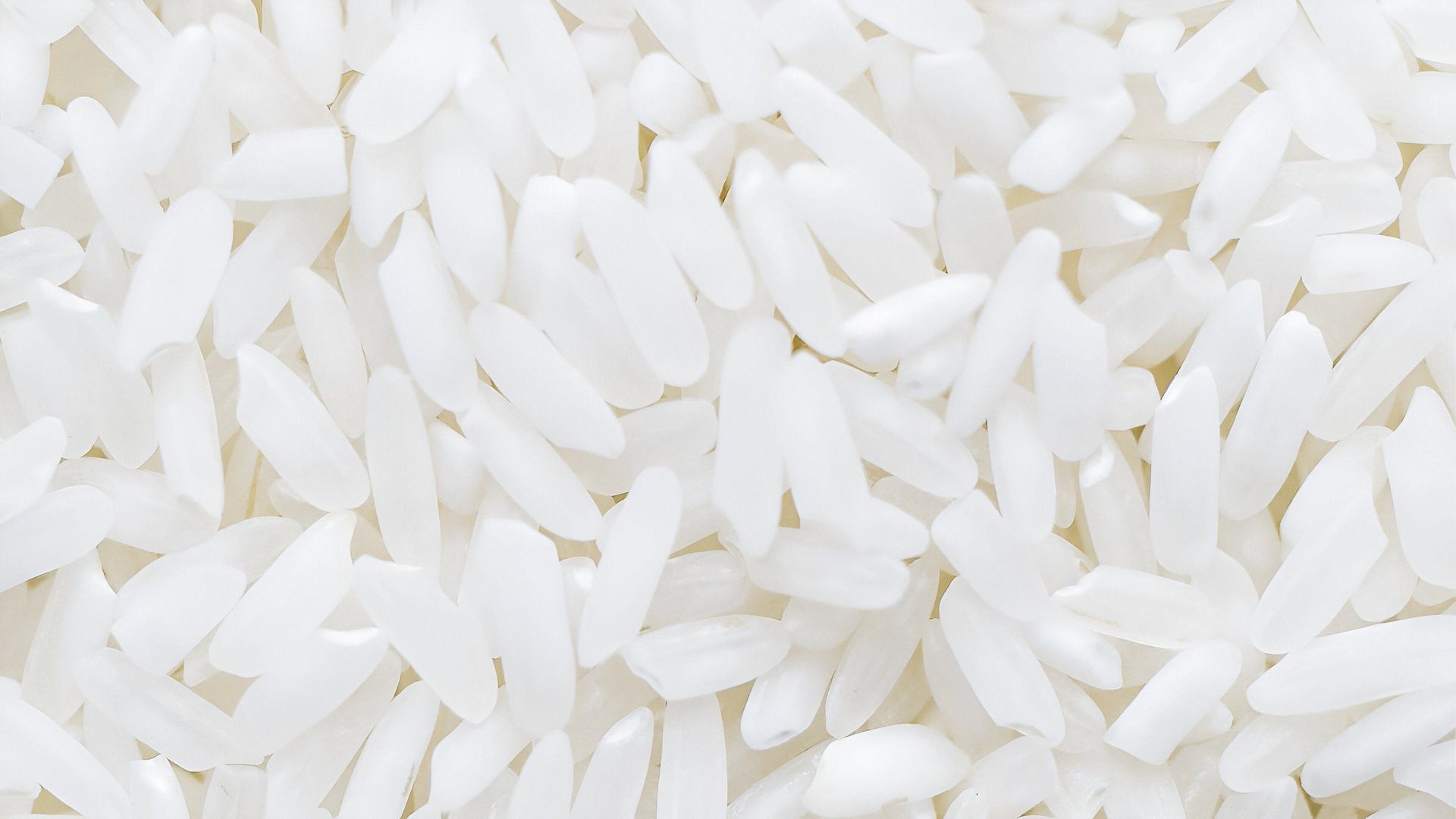 Dry Uncooked White Rice Texture Background