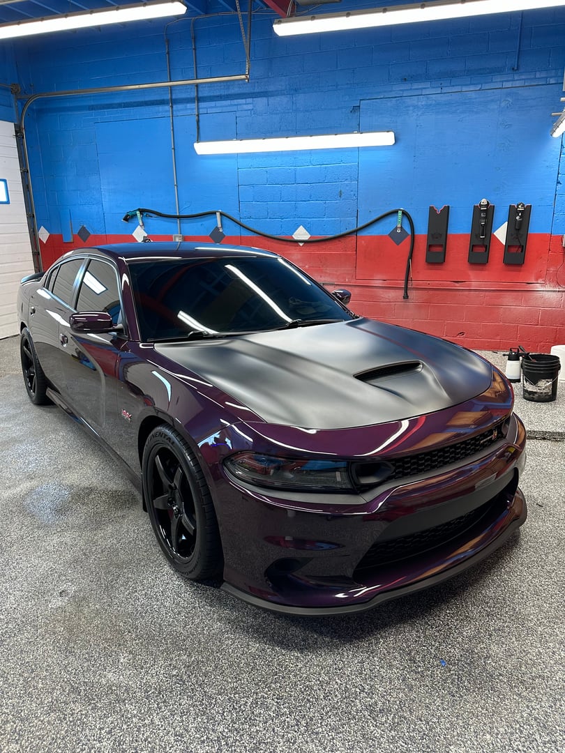 Silver SUV with mirror-like finish after detailing