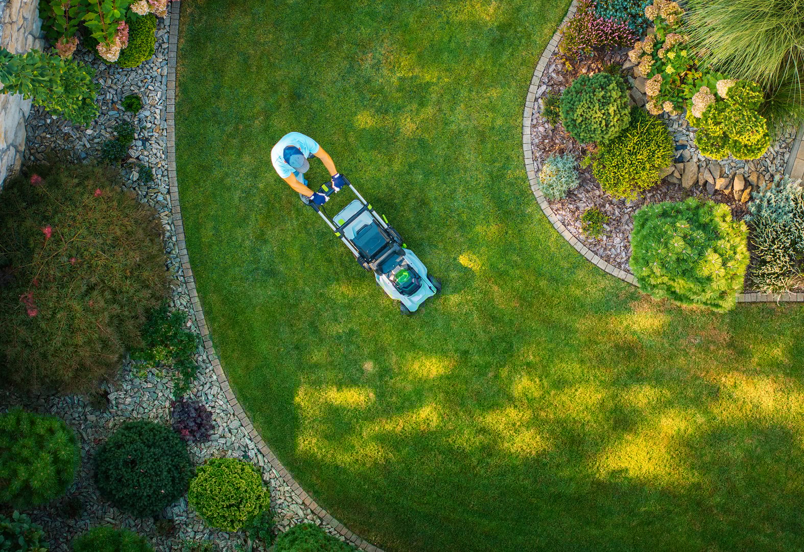 Lush green lawn in beautifully landscaped garden