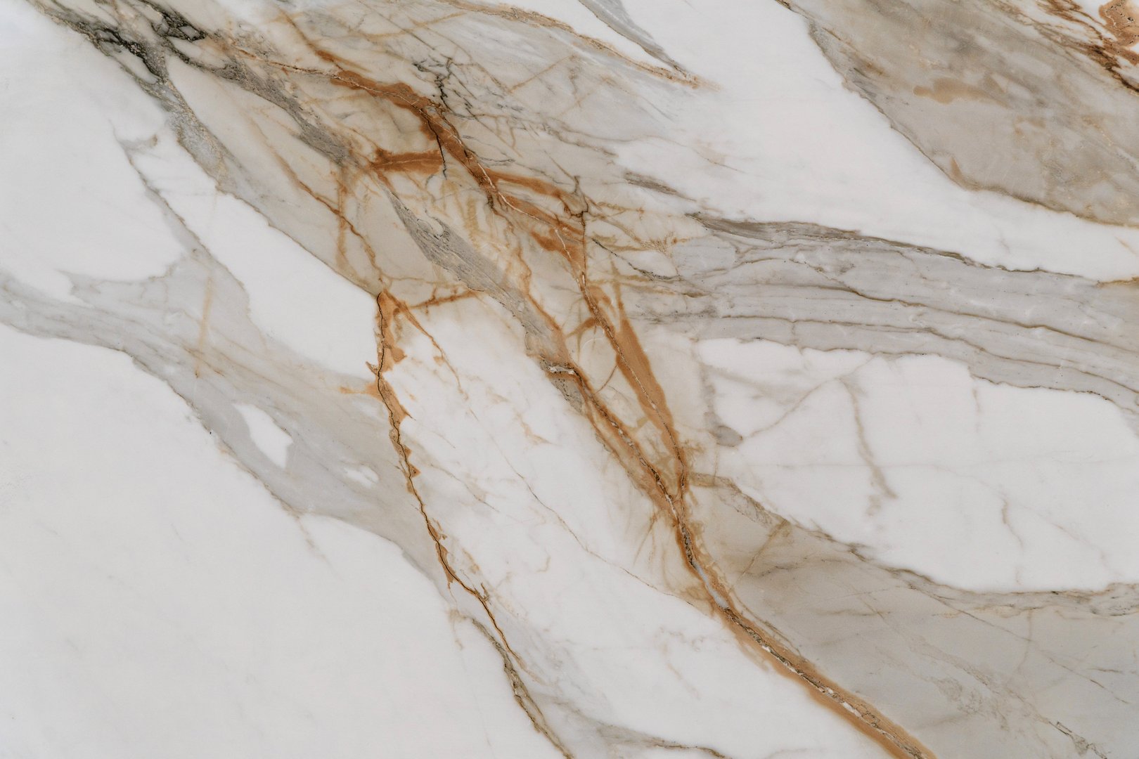 Creamy white marble with gold and gray dynamic veins