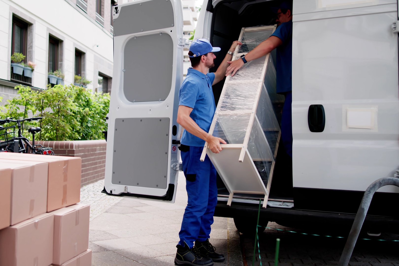 Hardworking Mover Delivers Furniture Across Town To Satisfied Customers.