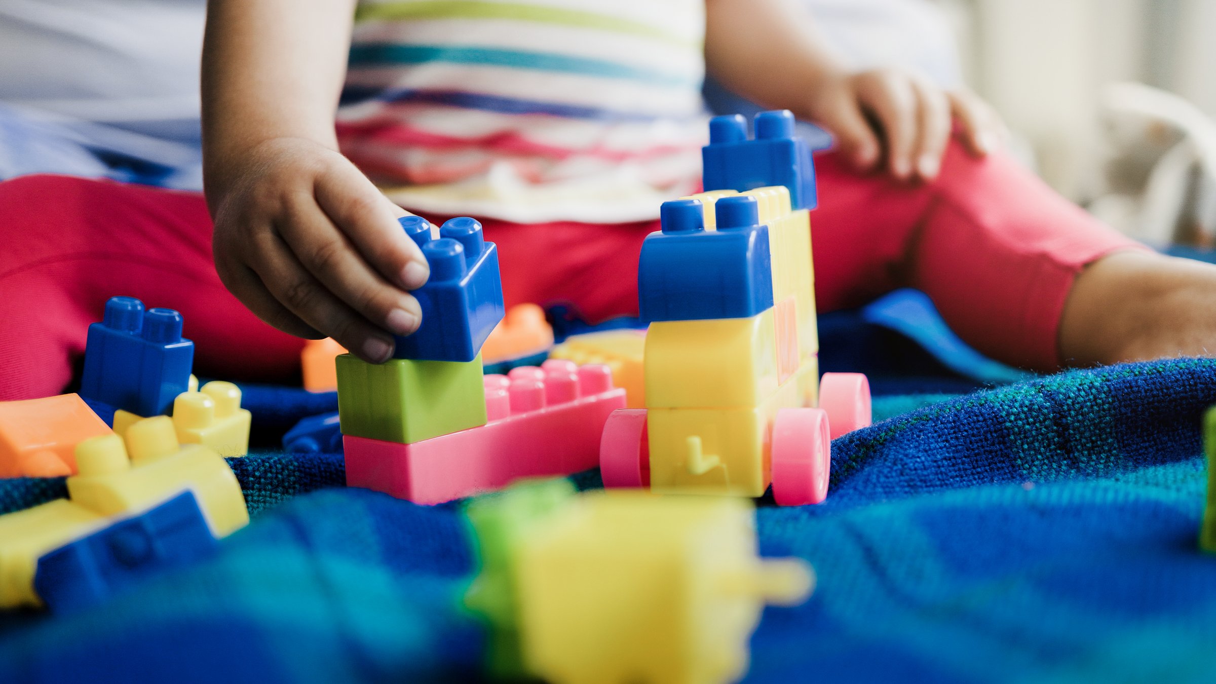 Kindergarten, Child playing with brick toys at daycare nursery. Education development games for school toddlers kids
