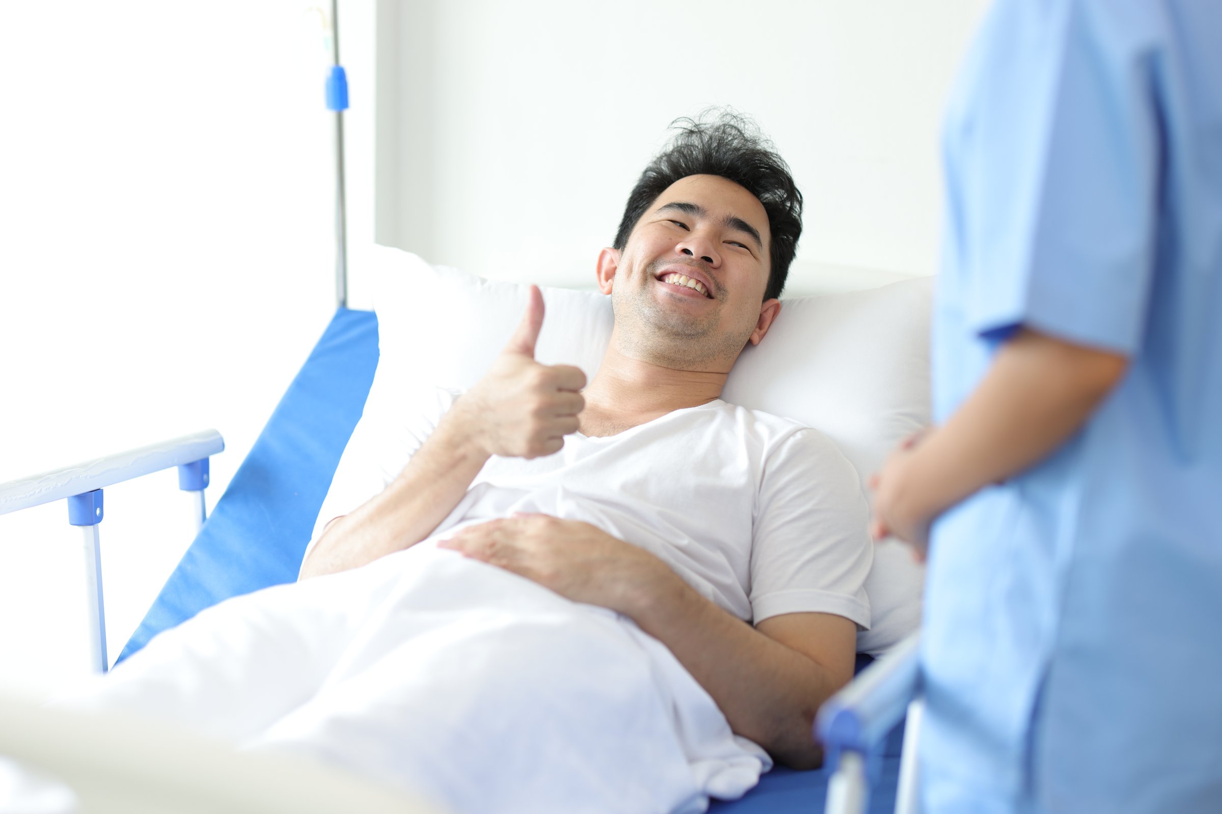 Female doctor visiting a patient in a hospital room. Health and medication consultation from specialist doctors.