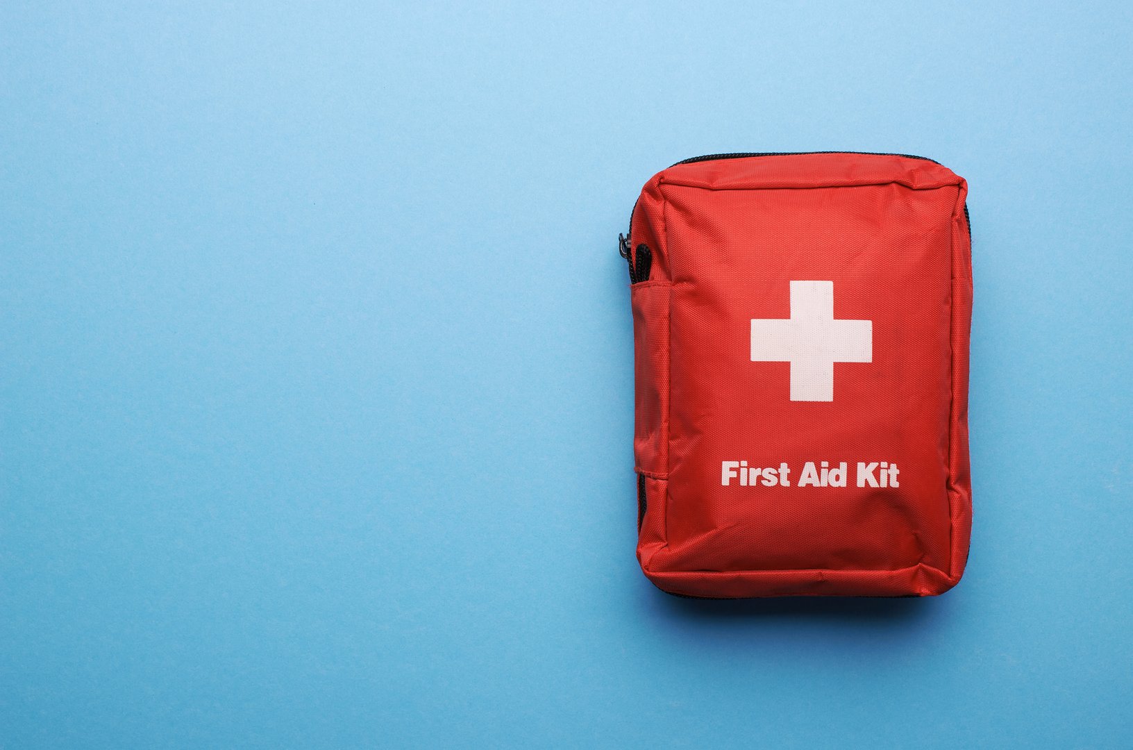 First Aid Kit on blue background