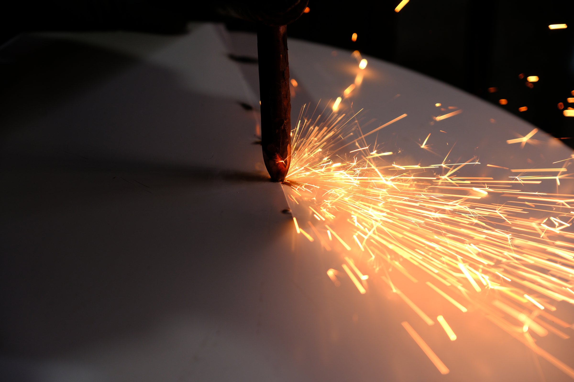 a master who welds sheet metal with spot welding