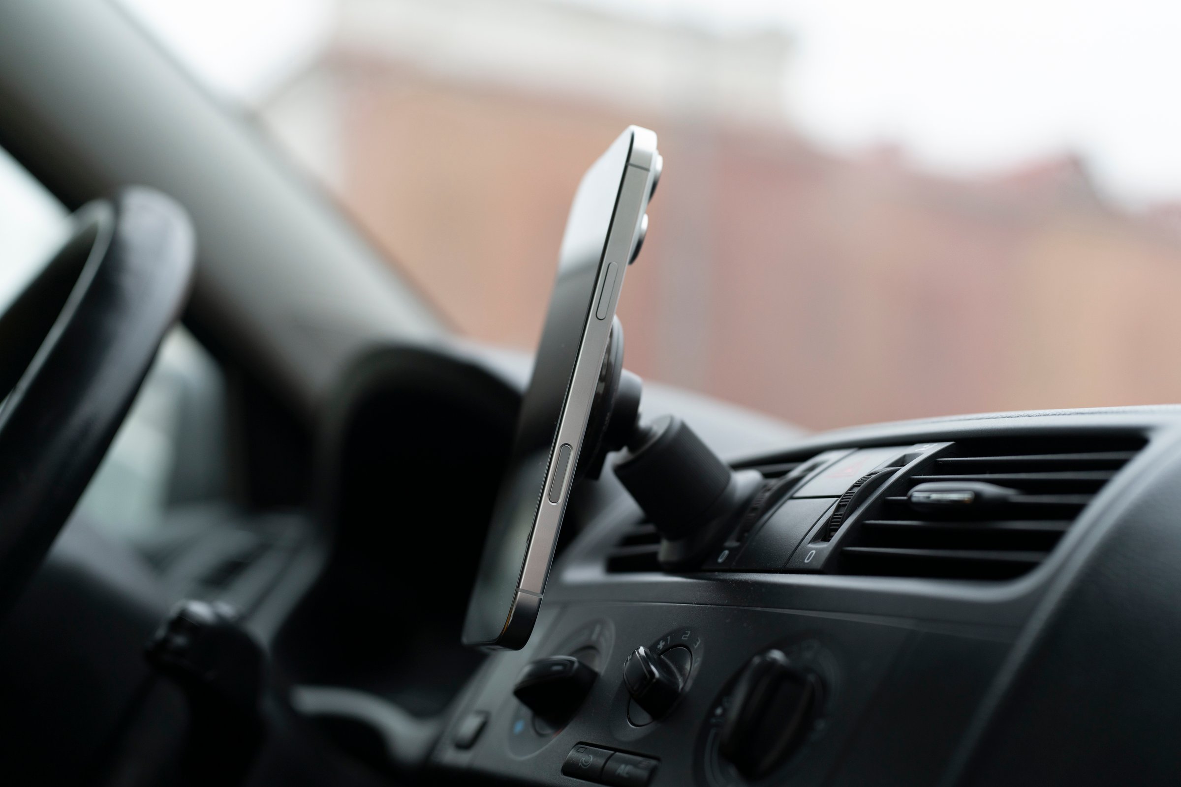Smartphone mounted on car dashboard
