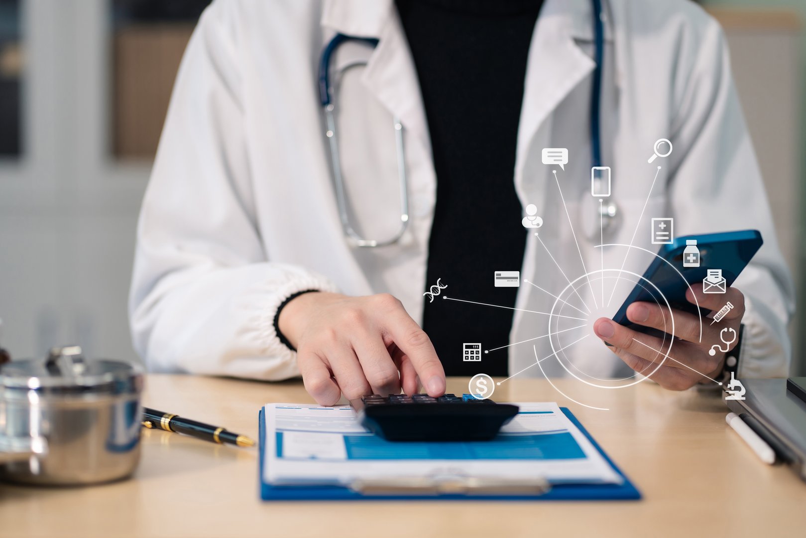 Hand of smart doctor used a calculator for medical costs