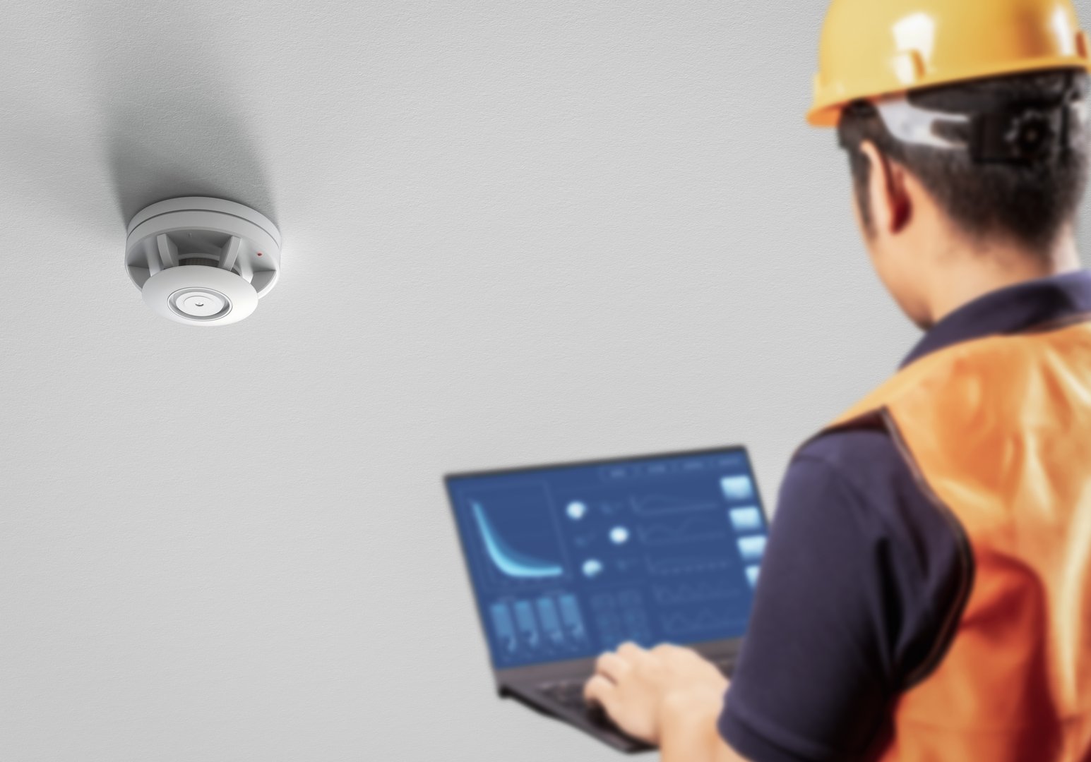 Engineer or technician control or program smoke detector on ceiling